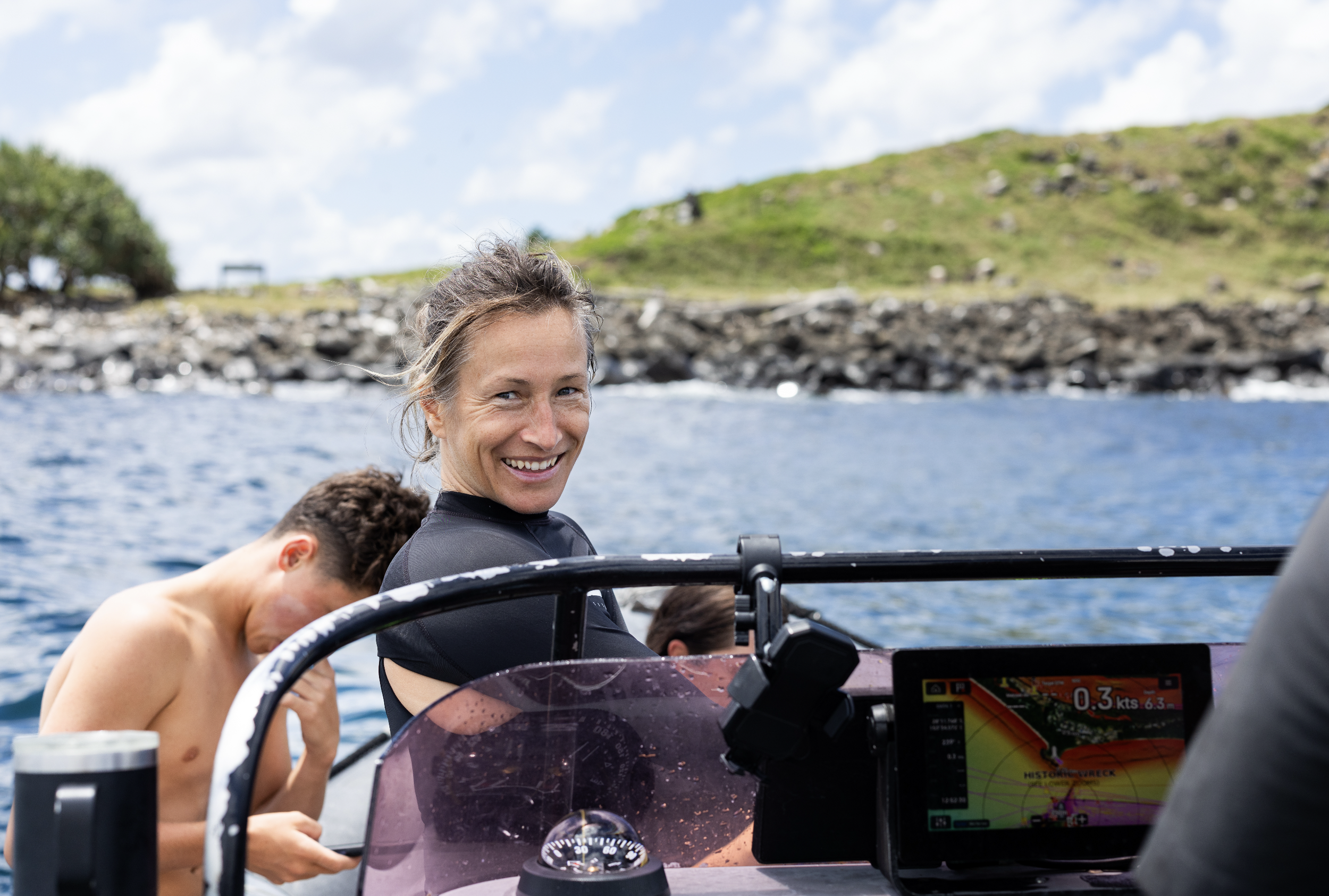 smiling divemaster on boat