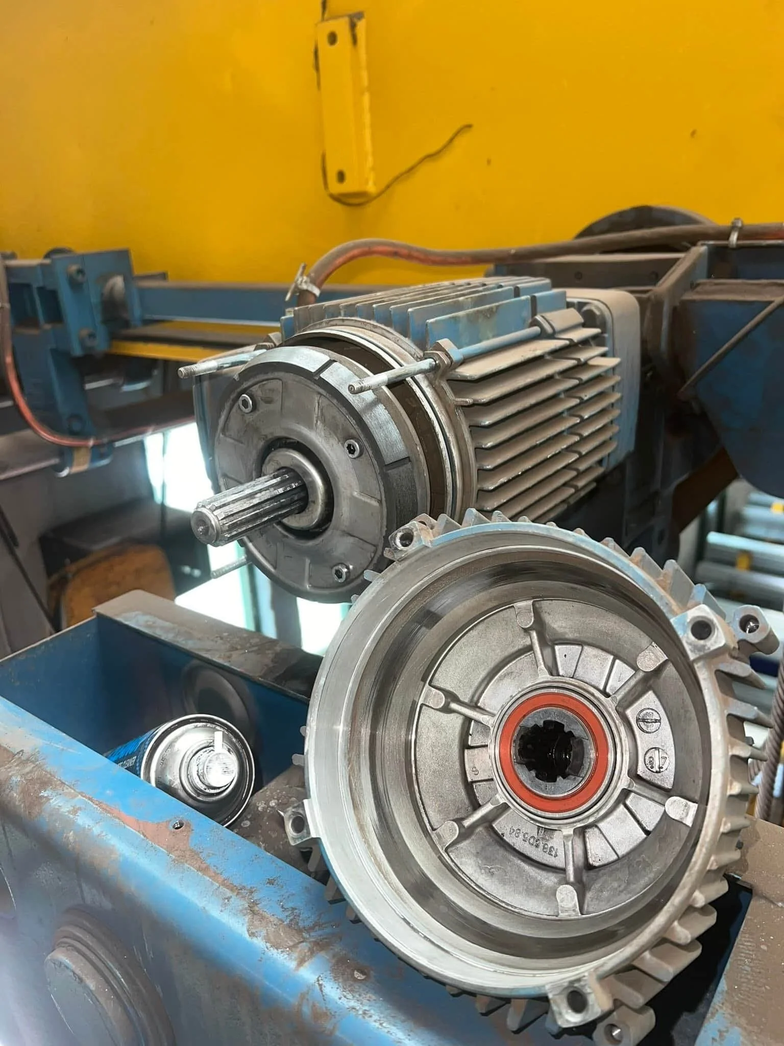 Crane travel drive motor and gearbox during 10 year major mechanical inspection, preventative maintenance and overhaul servicing.