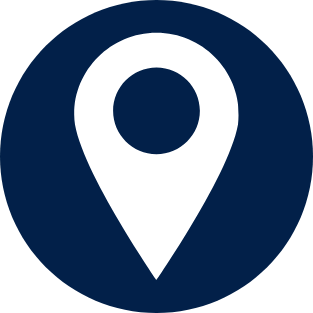 A map pin icon inside a dark blue circle.