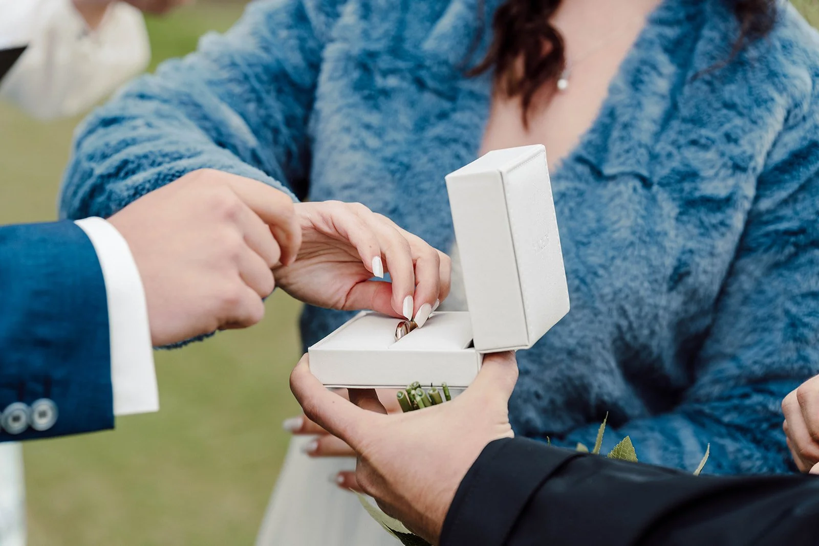 Close-up of wedding ring exchange during an intimate elopement ceremony in Iceland