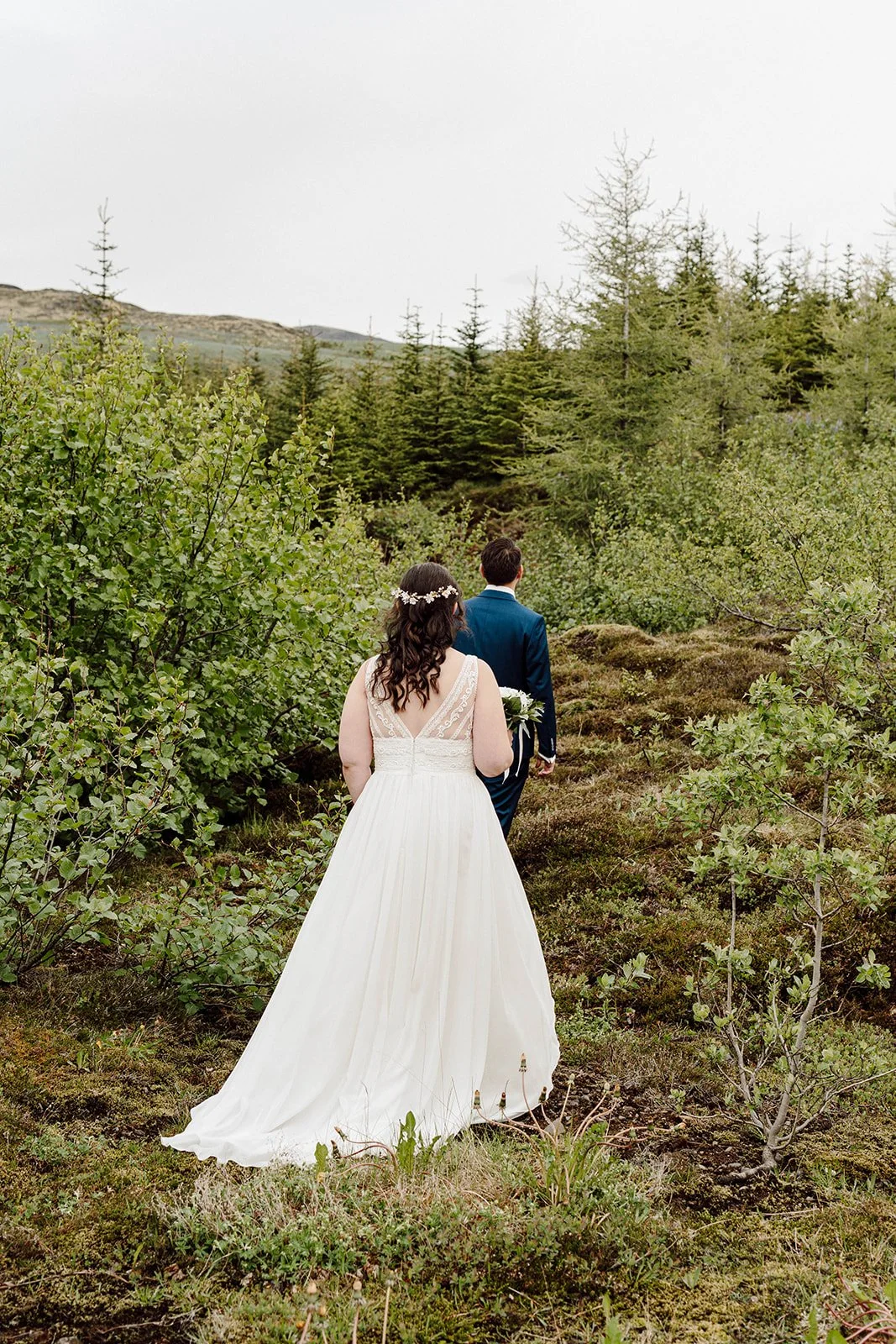 Couple exploring Icelandic landscape during their elopement photographed by Kamil Grygo