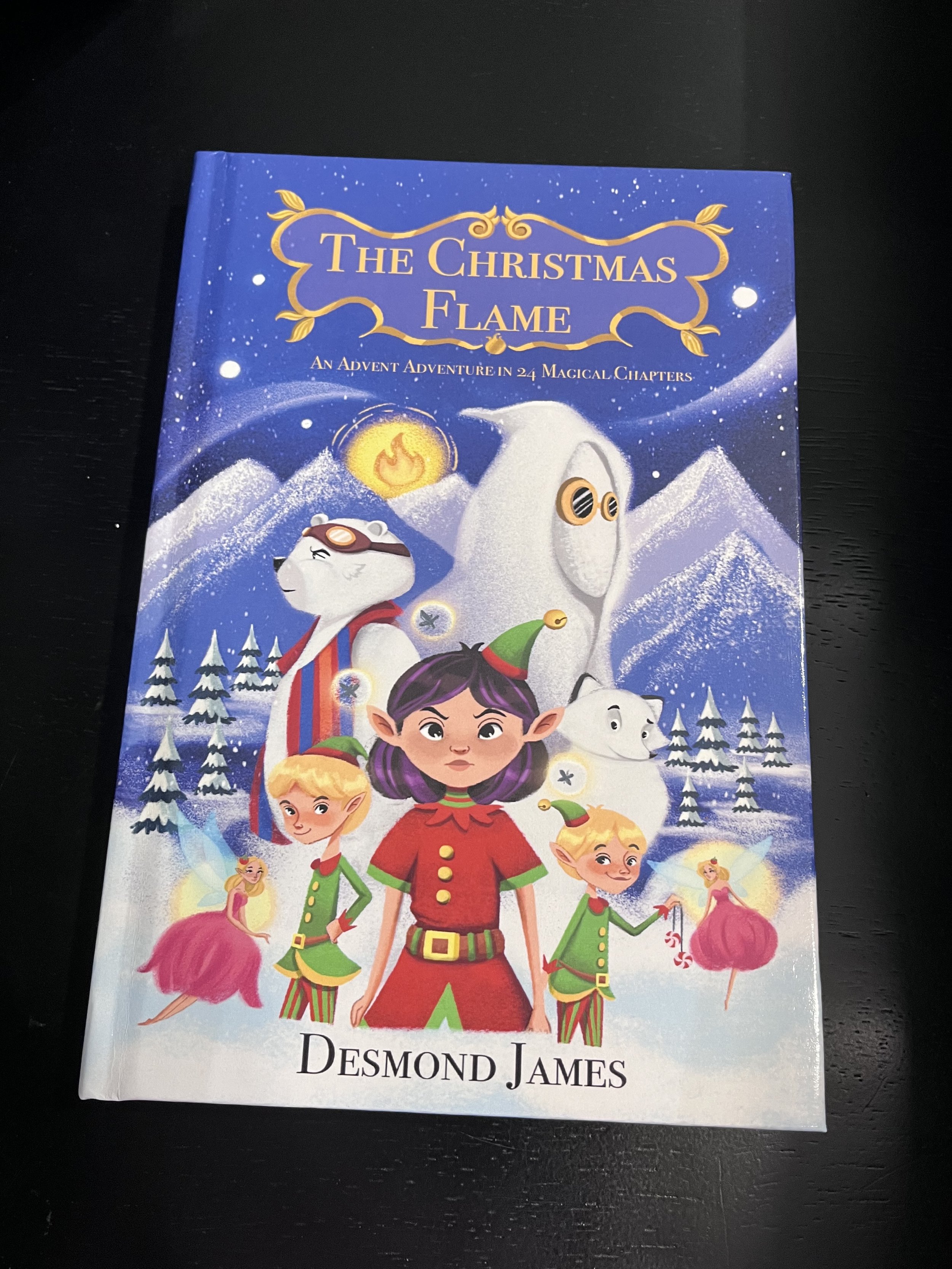 The Christmas Flame hardback edition with 24 B&W illustrations