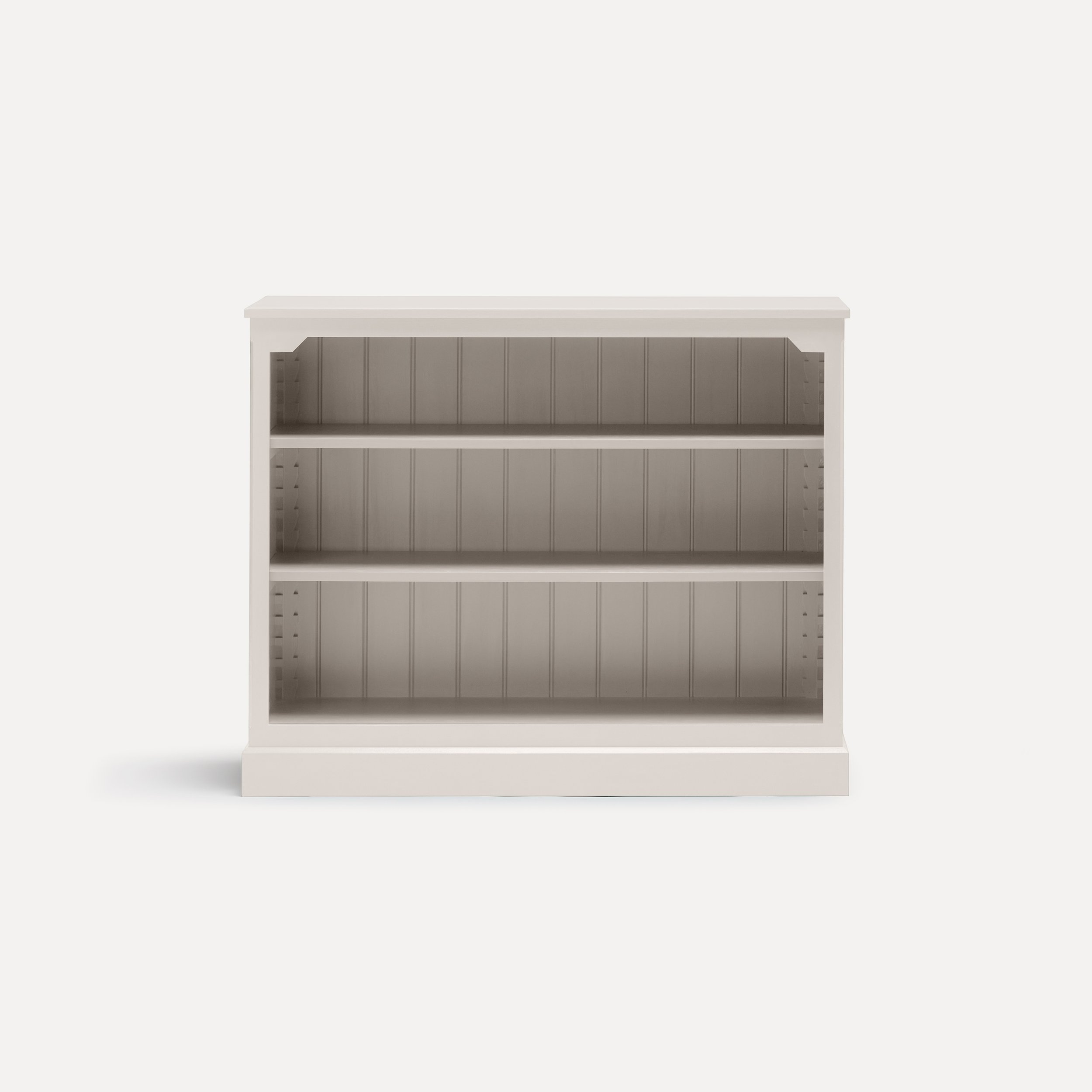 Rustic style semi bespoke hand painted traditional wooden bookcase designed by Imperfect Interiors and Pilgrim House