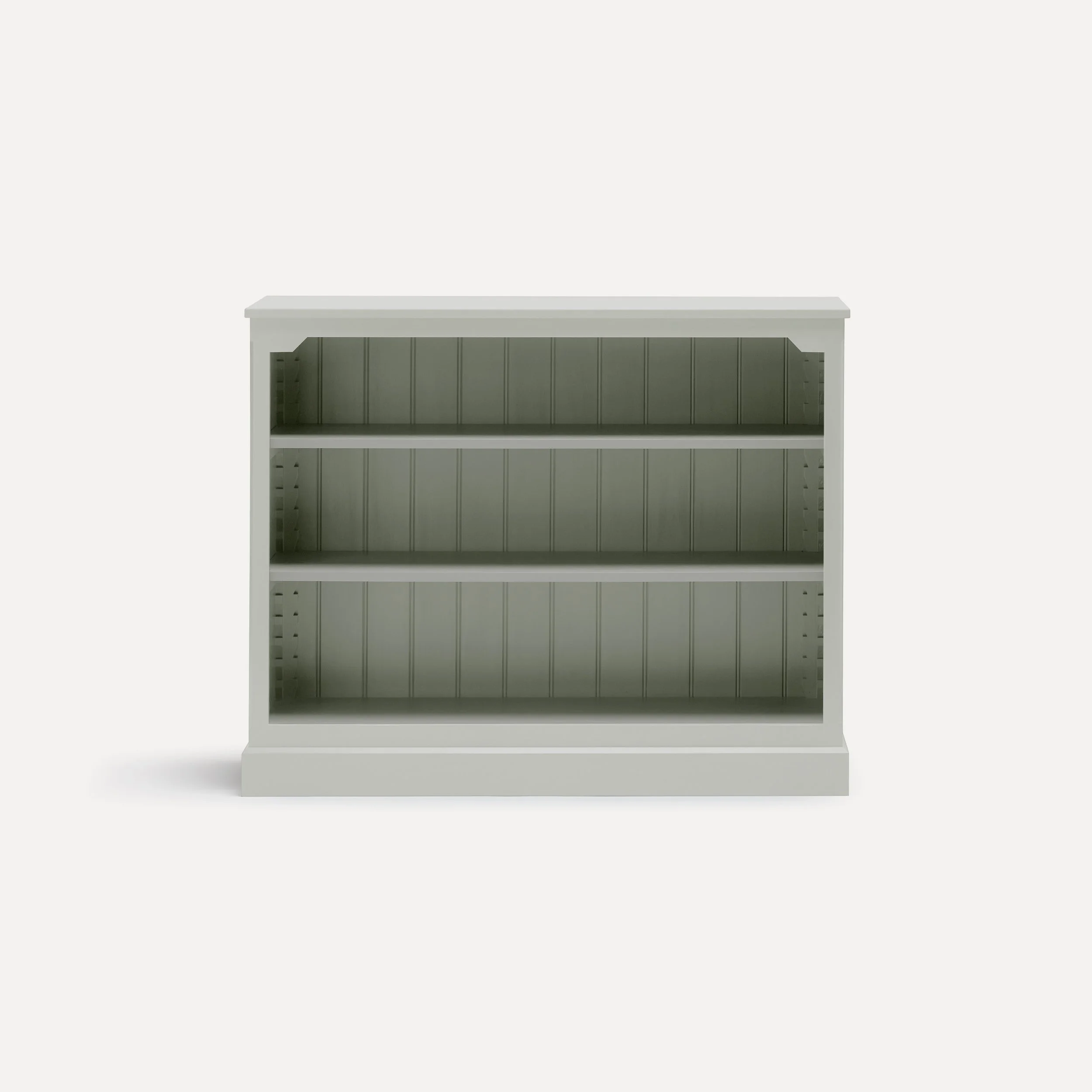 Rustic style semi bespoke hand painted traditional wooden bookcase designed by Imperfect Interiors and Pilgrim House