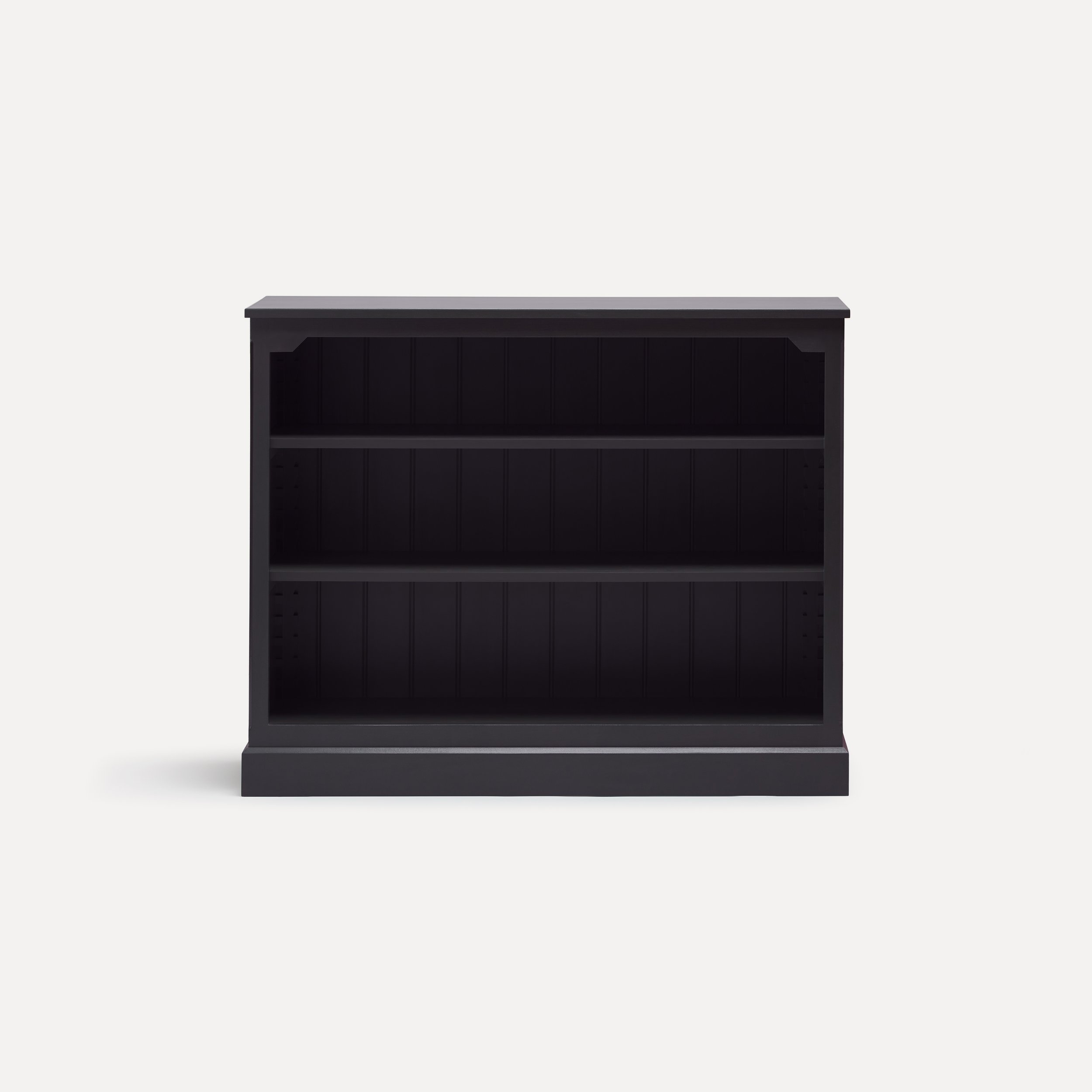 Rustic style semi bespoke hand painted traditional wooden bookcase designed by Imperfect Interiors and Pilgrim House