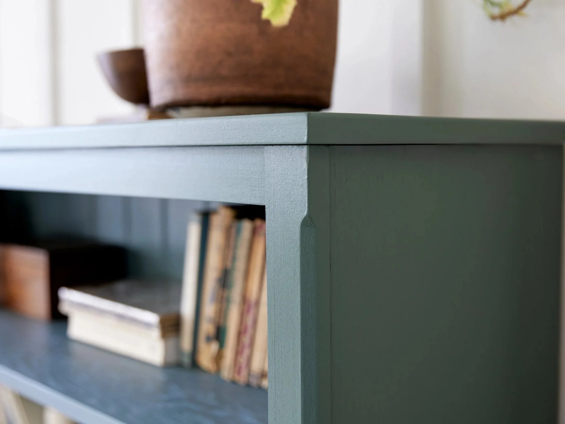 Freestanding semi bespoke hand painted traditional wooden bookcase designed by Imperfect Interiors and Pilgrim House