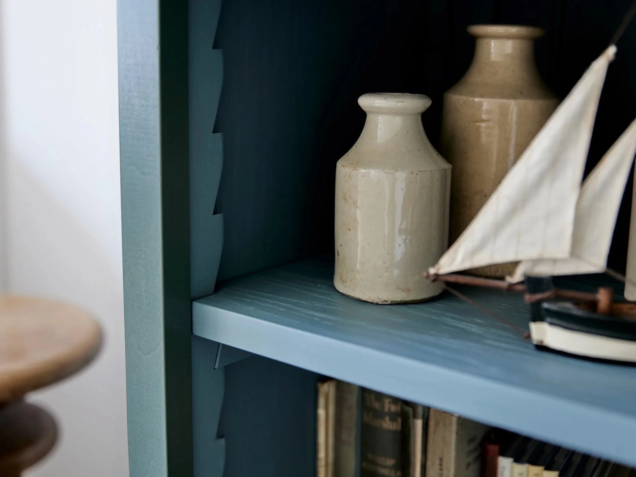 Freestanding semi bespoke hand painted traditional wooden bookcase designed by Imperfect Interiors and Pilgrim House