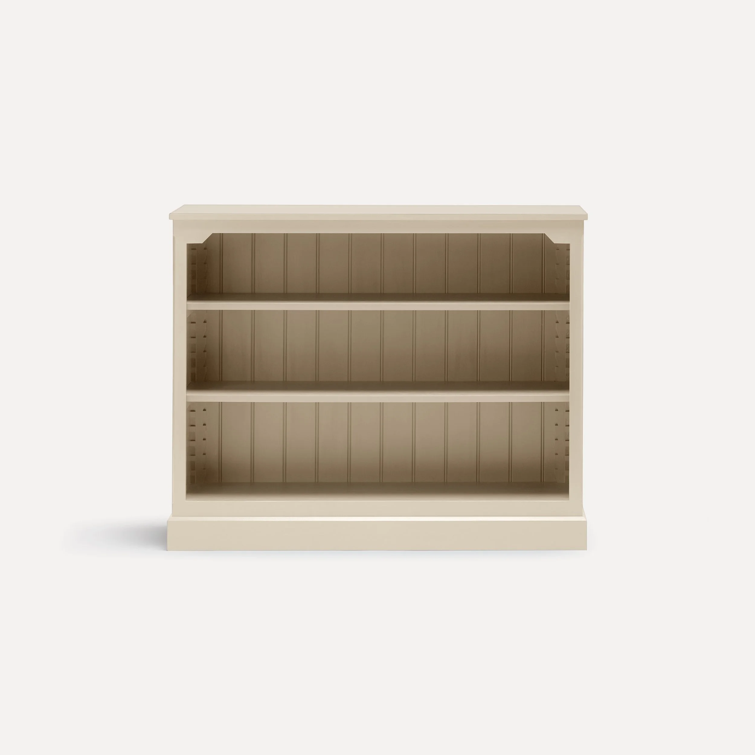 Rustic style semi bespoke hand painted traditional wooden bookcase designed by Imperfect Interiors and Pilgrim House