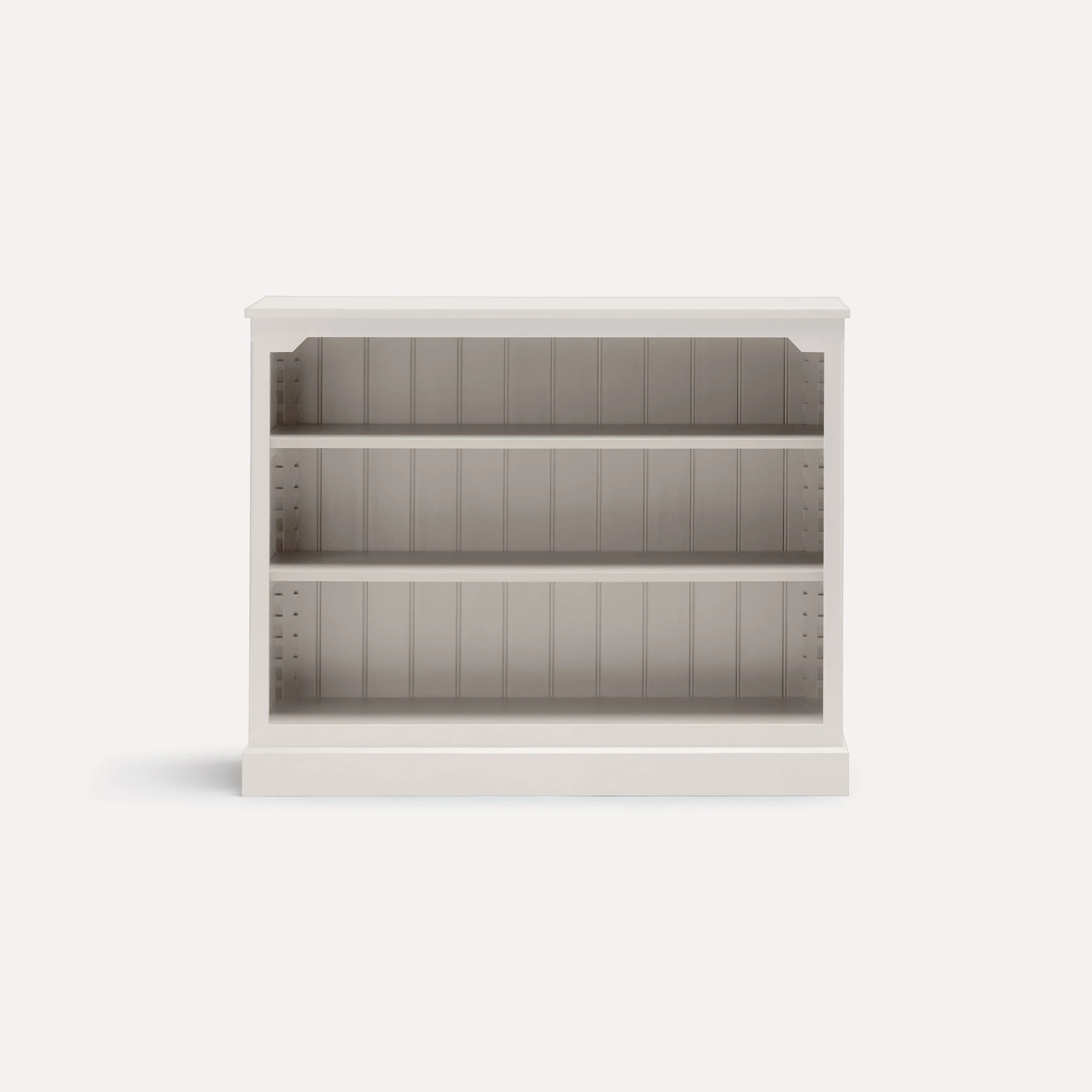 Rustic style semi bespoke hand painted traditional wooden bookcase designed by Imperfect Interiors and Pilgrim House