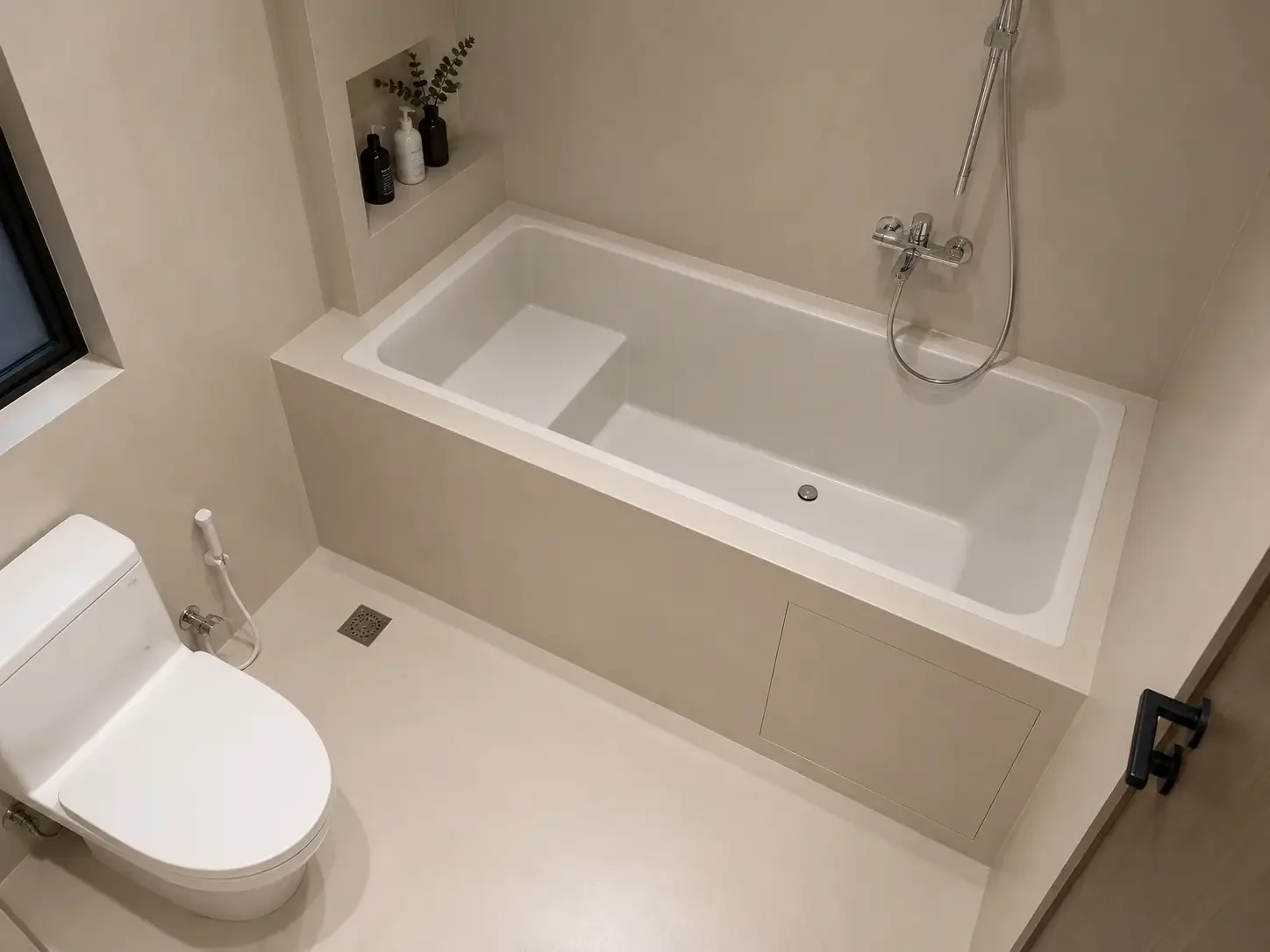 Singapore bathroom with microcement walls and bathtub surround in a light beige finish.