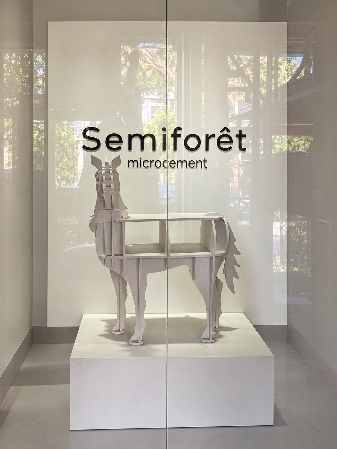 Semiforêt window display with a sculptural horse beneath the brand wordmark.