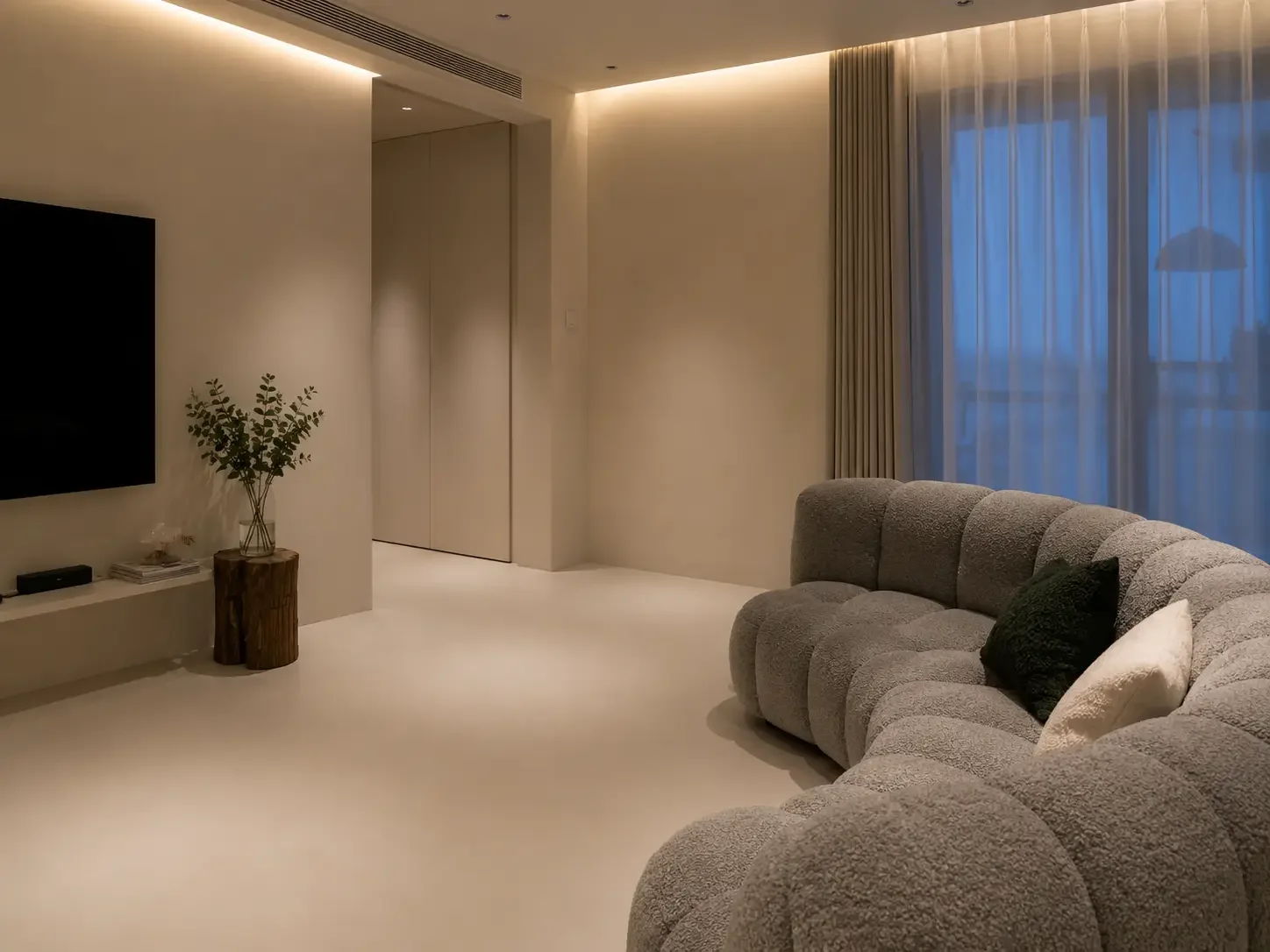 Light beige microcement floor and wall finish in a Singapore apartment living area.