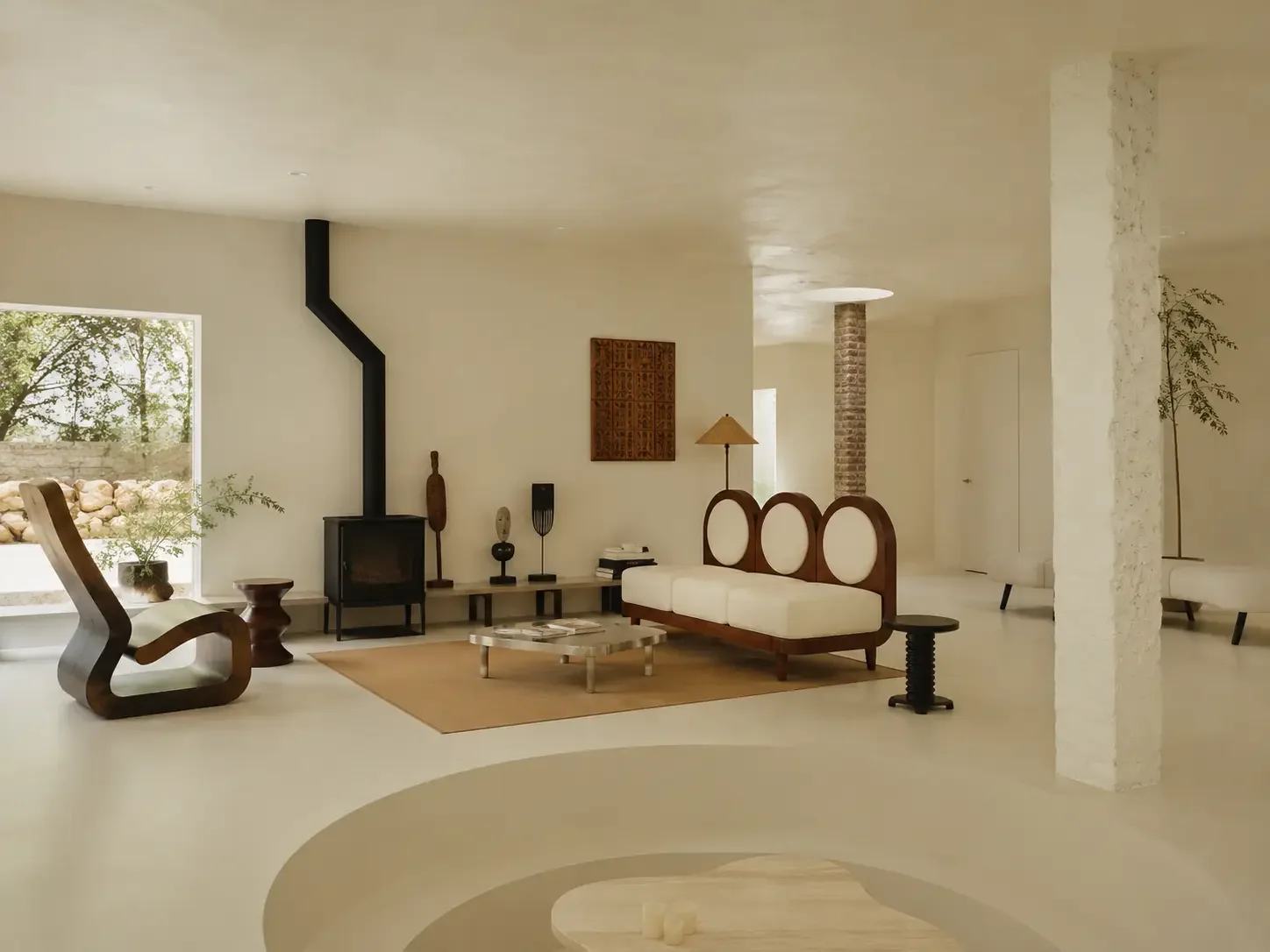 Boutique hotel lounge in China with light beige microcement surfaces and sculptural furniture.