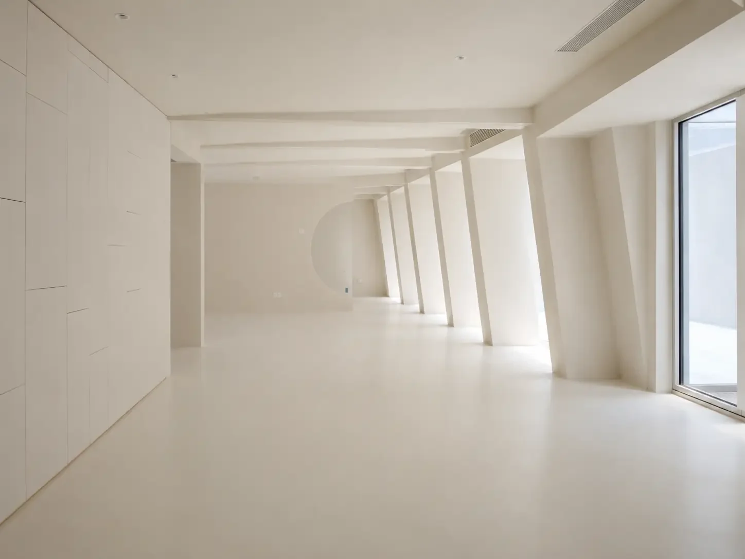 Open villa corridor in China with seamless light microcement floor and wall surfaces.