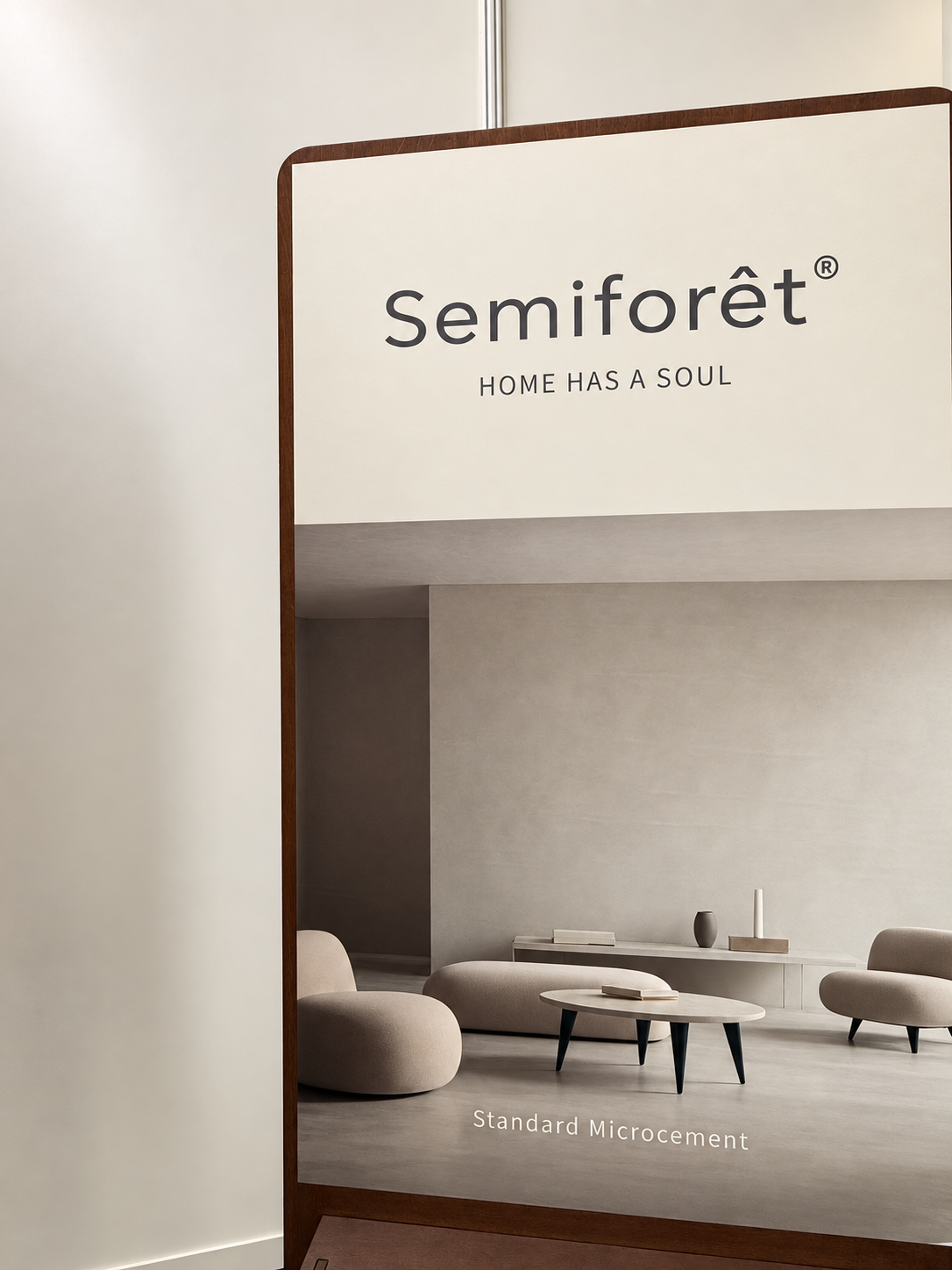 Semiforêt display board featuring the Home Has a Soul slogan and a microcement interior illustration.