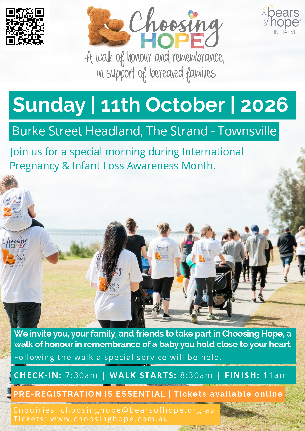 People participating in the Choosing Hope walk along a pathway outdoors near a body of water, with trees in the background. Many attendees are wearing white shirts with the event's logo.