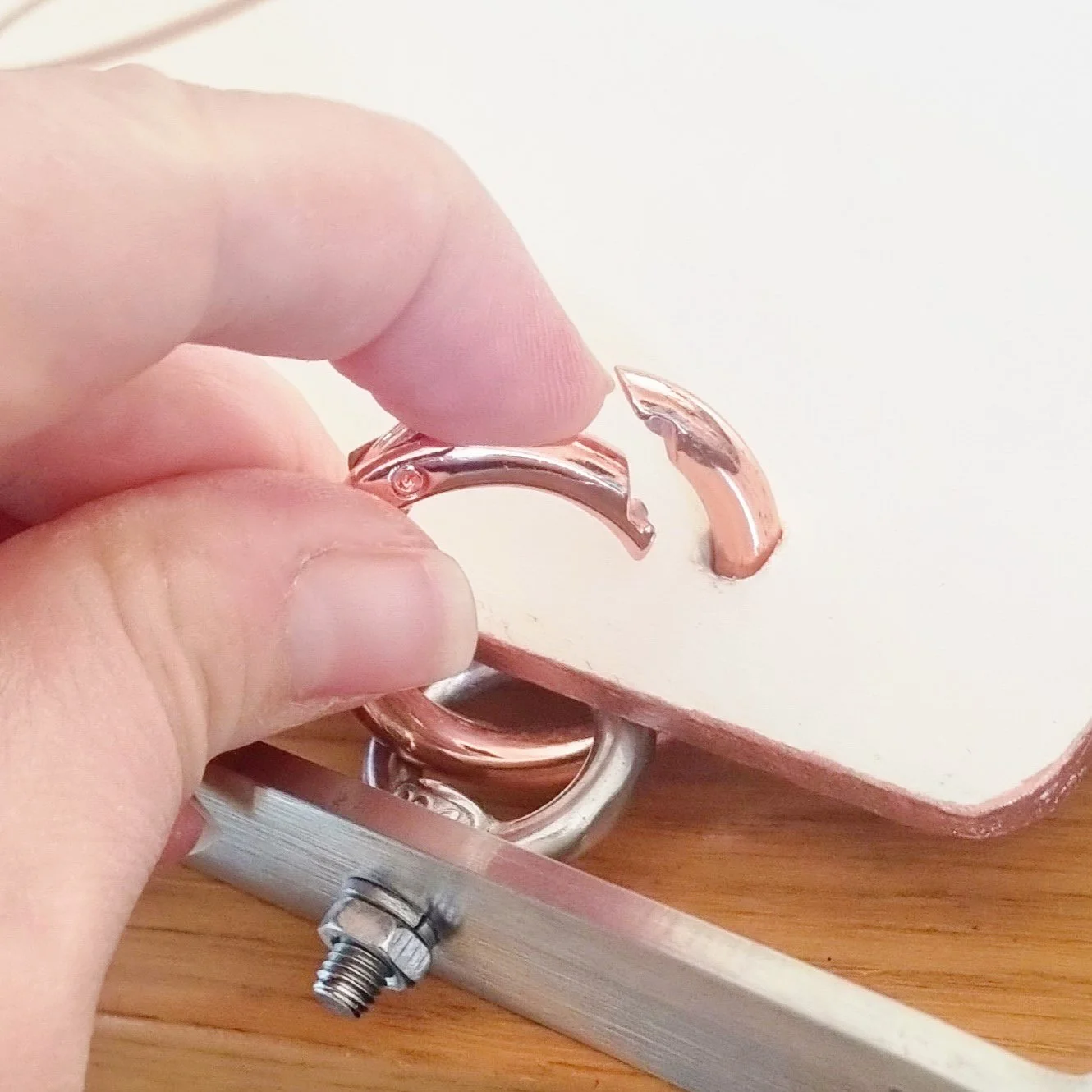 Showing how a spring o-ring is opened.