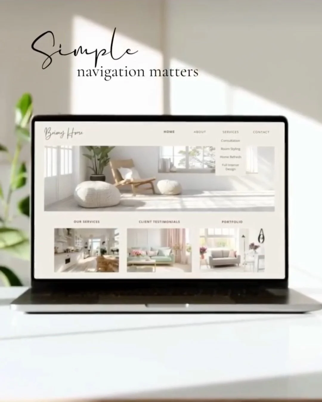 Laptop displaying a clean, minimal website layout with simple navigation and soft neutral styling on a bright desk background