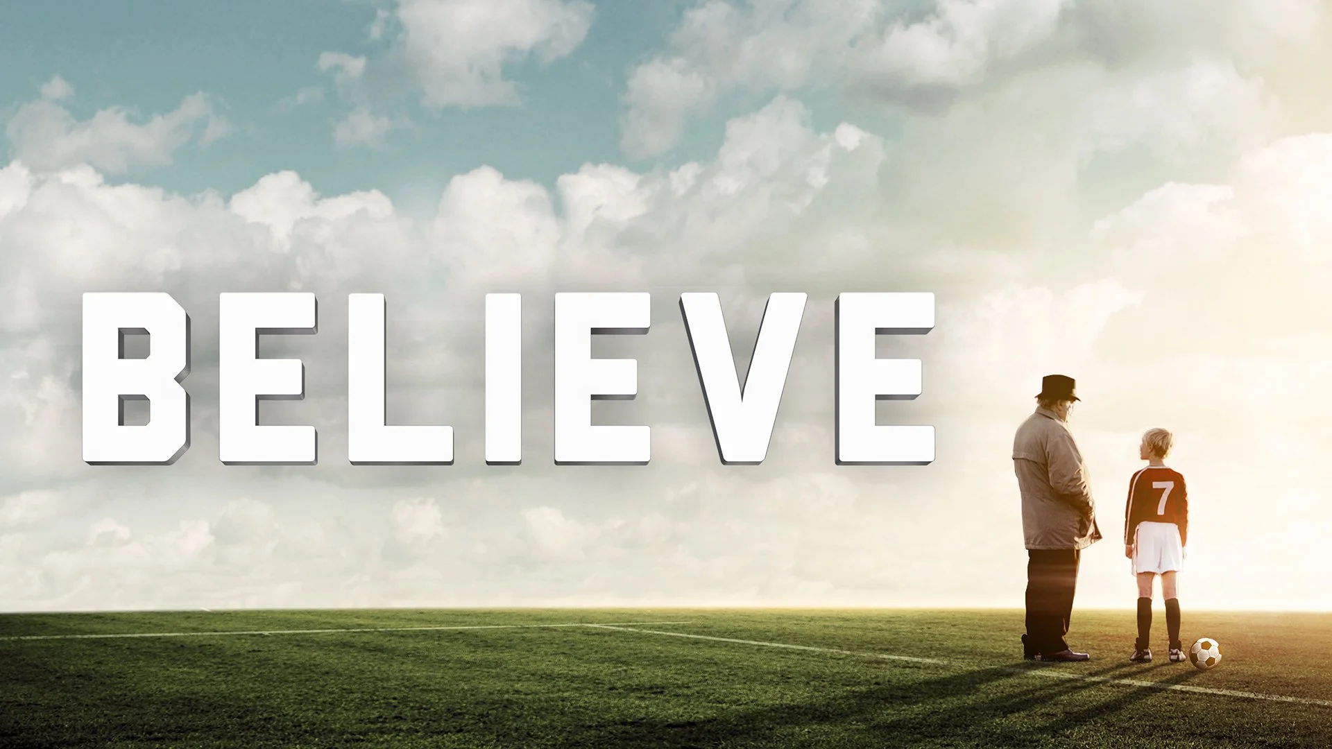 A man and a young girl stand on a soccer field, facing each other, with a soccer ball on the ground near the girl. The background features a cloudy sky and the word 'BELIEVE' in large, bold 3D letters.