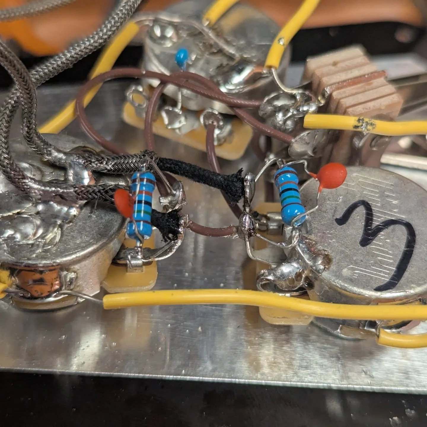 Installed some treble bleeds on my V just for fun. Oh and don't EVER buy a pre-made treble bleed, they're charging you $10-$15 for literally less than $1 worth of parts and 30 seconds of soldering.