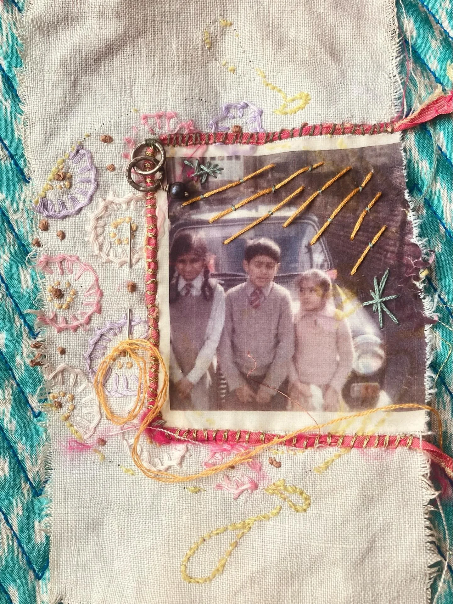 Sibling slow-stitched scroll panel-in-progress. 

My big sisters &amp; brother. Around 1968/9. Sheffield. 

Vintage linen/embroidered &amp; tea stained cloth. Pink sari curtain frame couched with metallic &amp; green threads. Silver hoops &amp; pearl