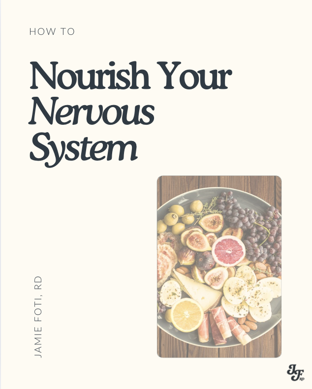 Cover of a book titled "Nourish Your Nervous System" with a subtitle "How To". The cover features a plate of assorted fruits including grapes, figs, citrus, and slices of cheese or similar food, on a wooden surface.
