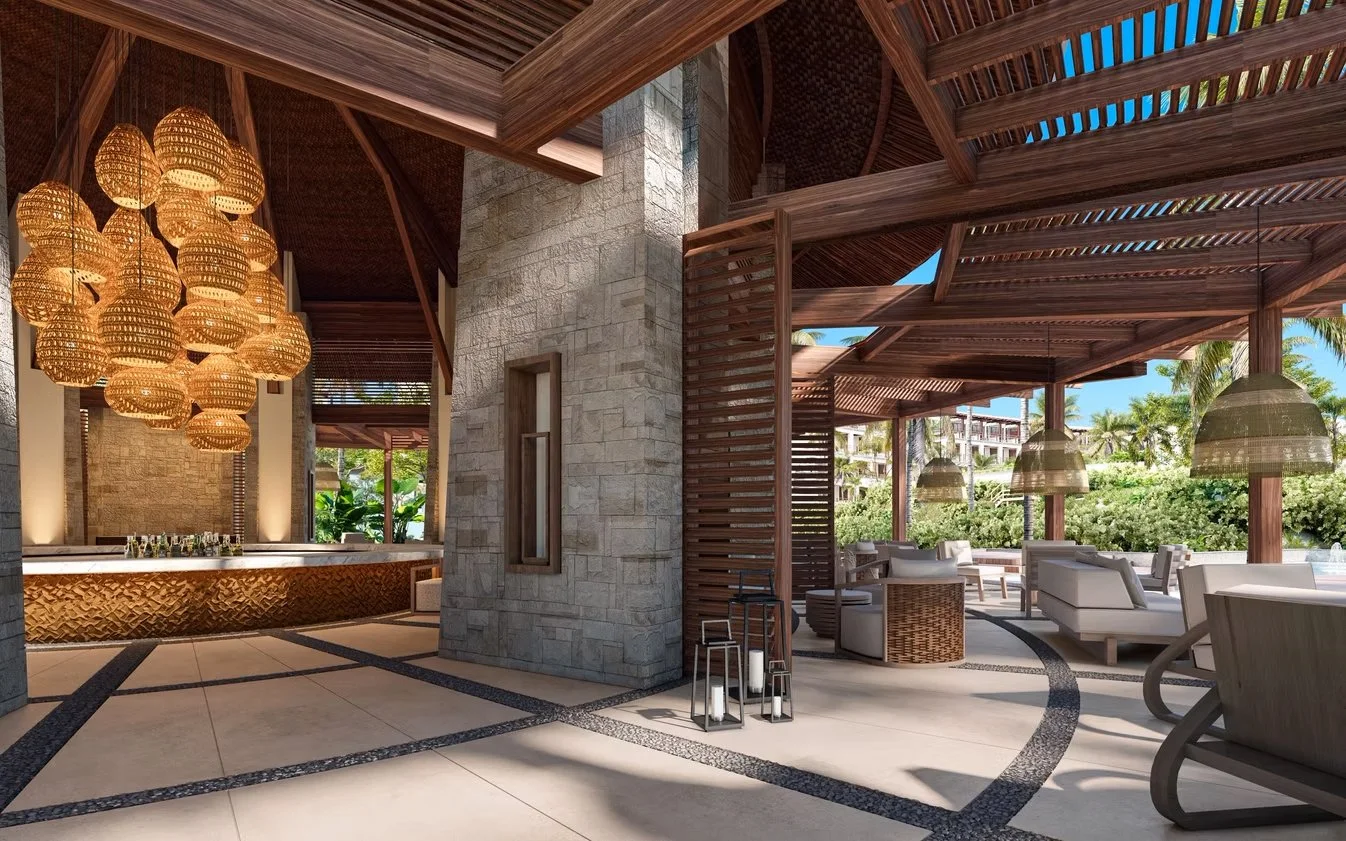 Luxurious outdoor lounge area with wooden structure, hanging wicker lighting, and comfortable seating surrounded by greenery.