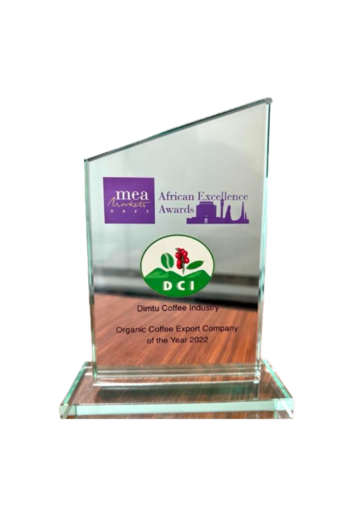 Glass award plaque with logos and text recognizing Dimtu Coffee Industry as the Organic Coffee Export Company of the Year 2022 at the African Excellence Awards.