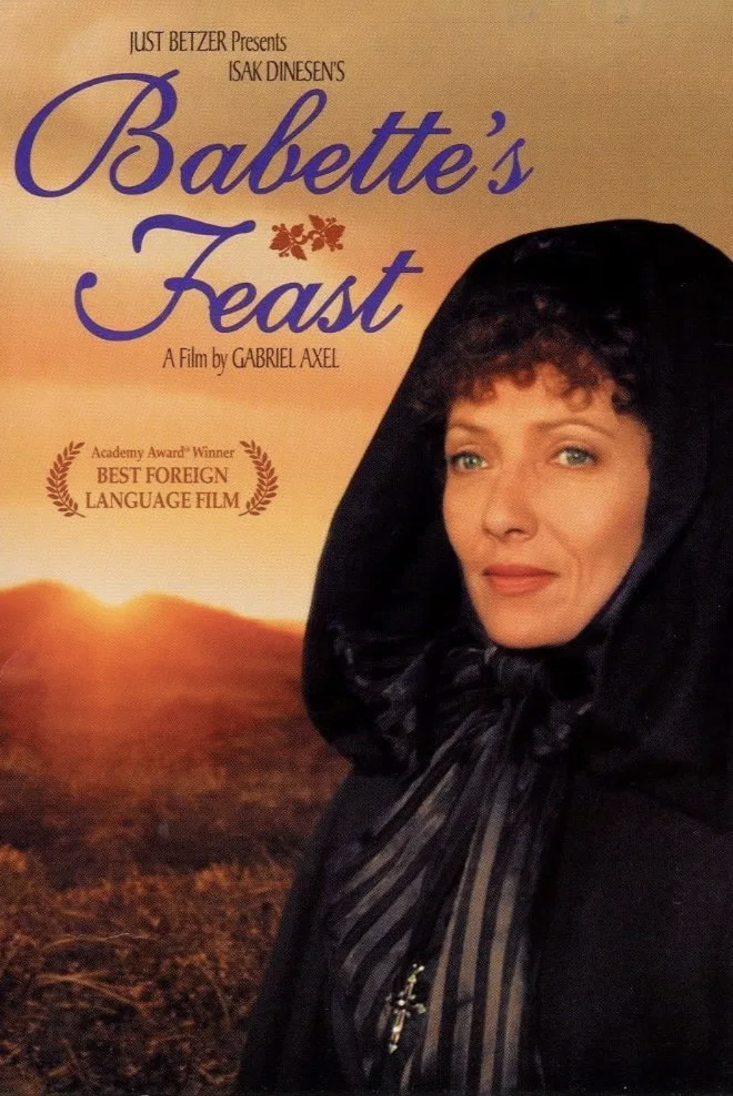 Movie poster for 'Babette's Feast,' featuring a woman in a black dress walking in a grassy field during sunset, with the title and awards displayed.