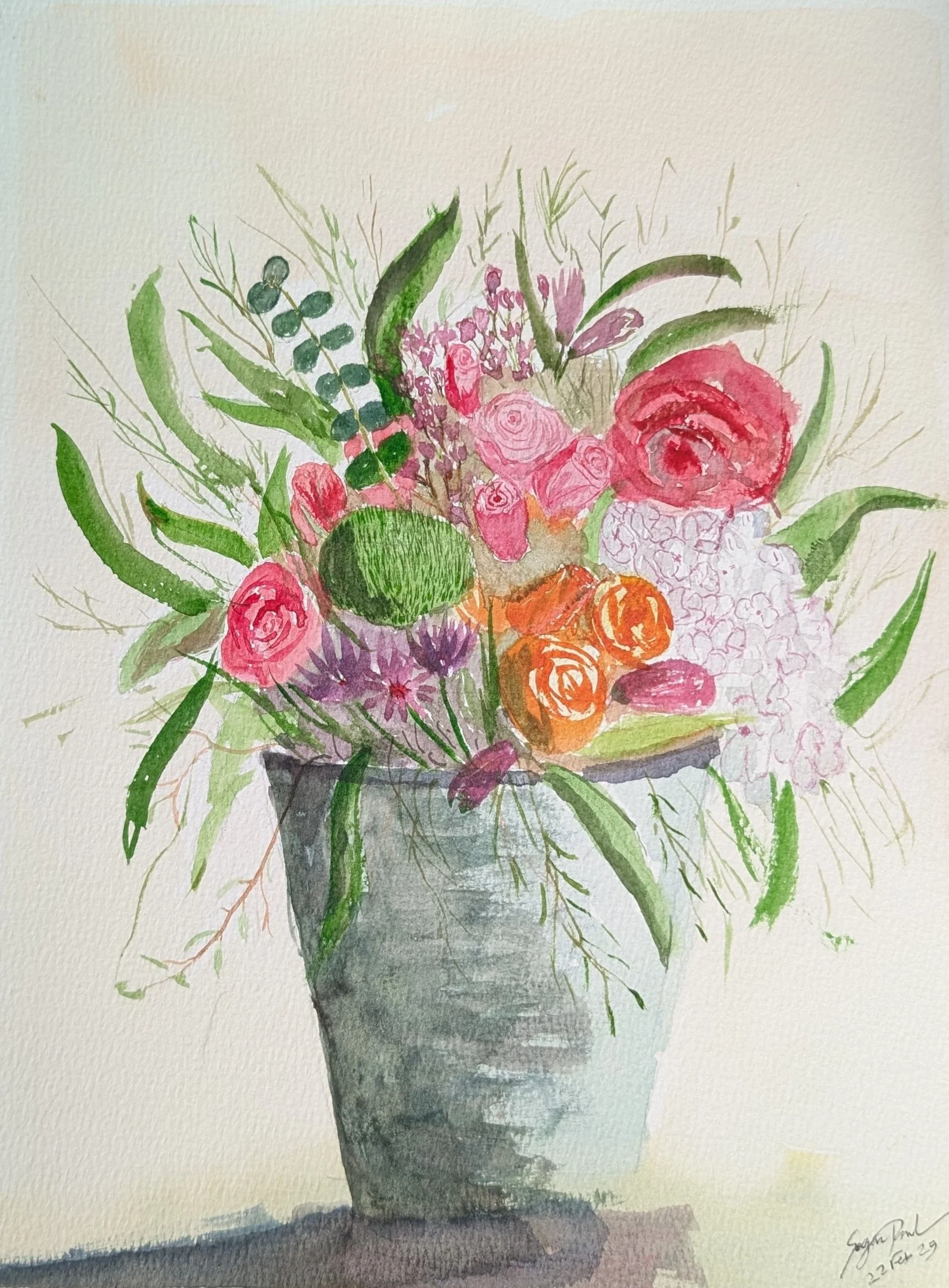 Watercolor painting of a bouquet of various pink, orange, and purple flowers in a gray vase with greenery.