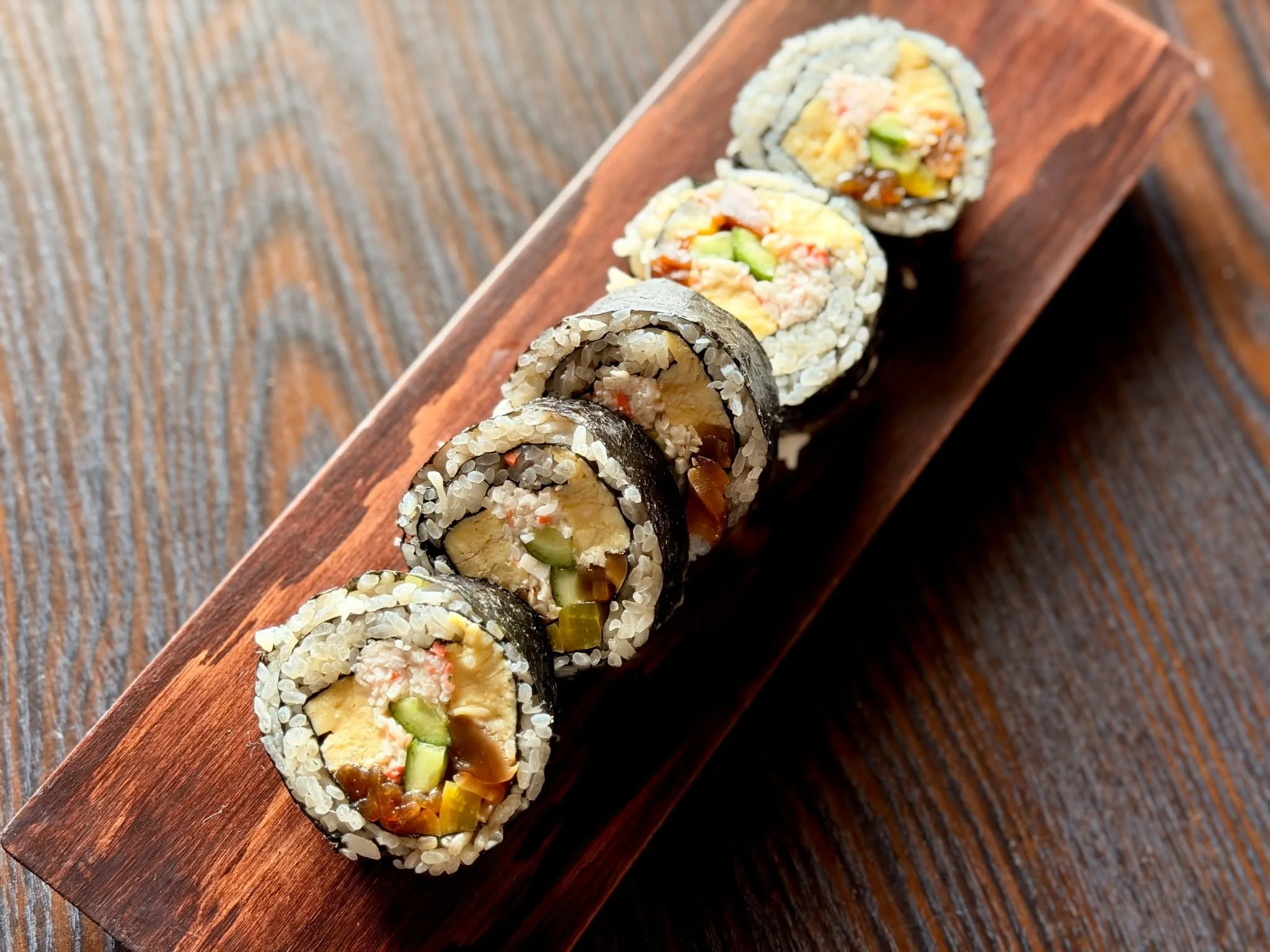 Bold. Traditional. Surprisingly satisfying.
Futomaki is one of the oldest styles of sushi, dating back to Japan&rsquo;s Edo period. Originally made as a celebratory roll, it brings together multiple ingredients&mdash;sweet tamago, fresh seafood, vege