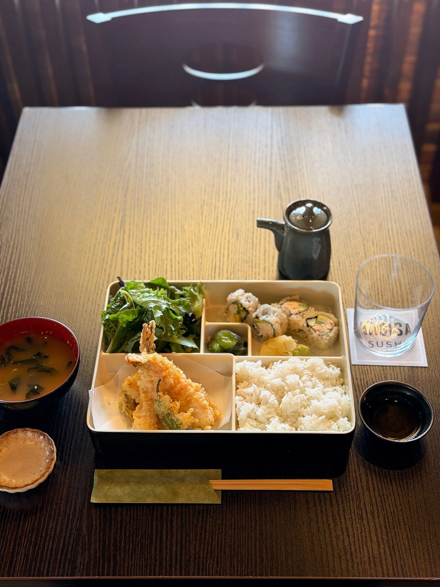 Bento box lunch spread with shrimp tempura, rice, salad, and a maki roll at Nagisa Sushi, Point Loma