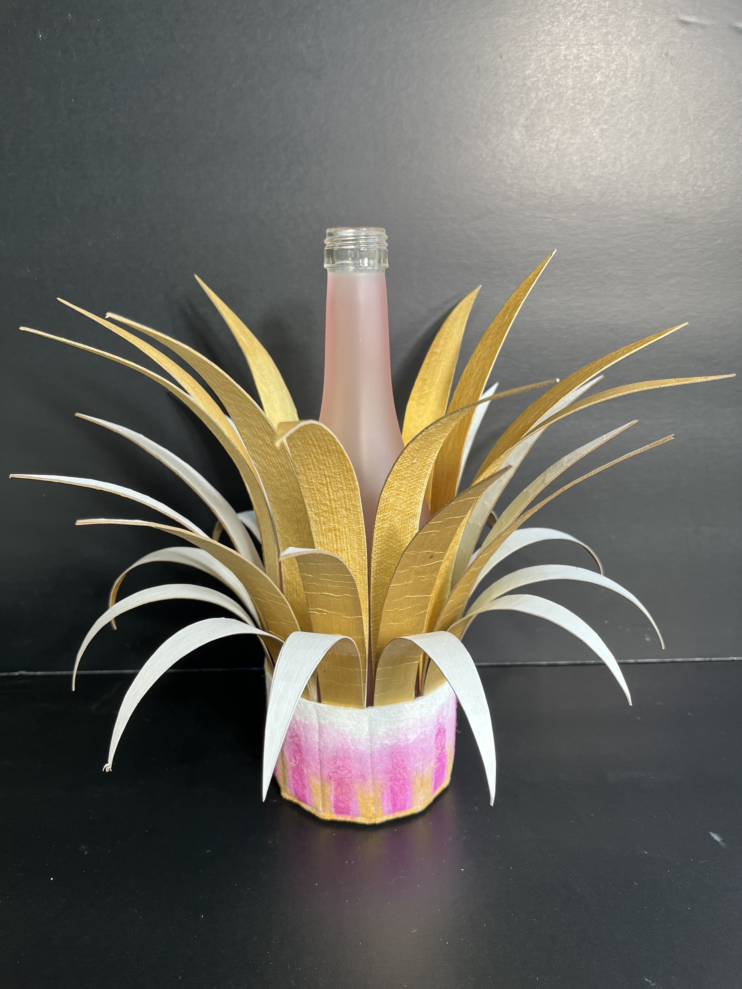 Bottle Crown:  Pink Bottle with Gold and White Spikes; Pink, Gold and White Base.