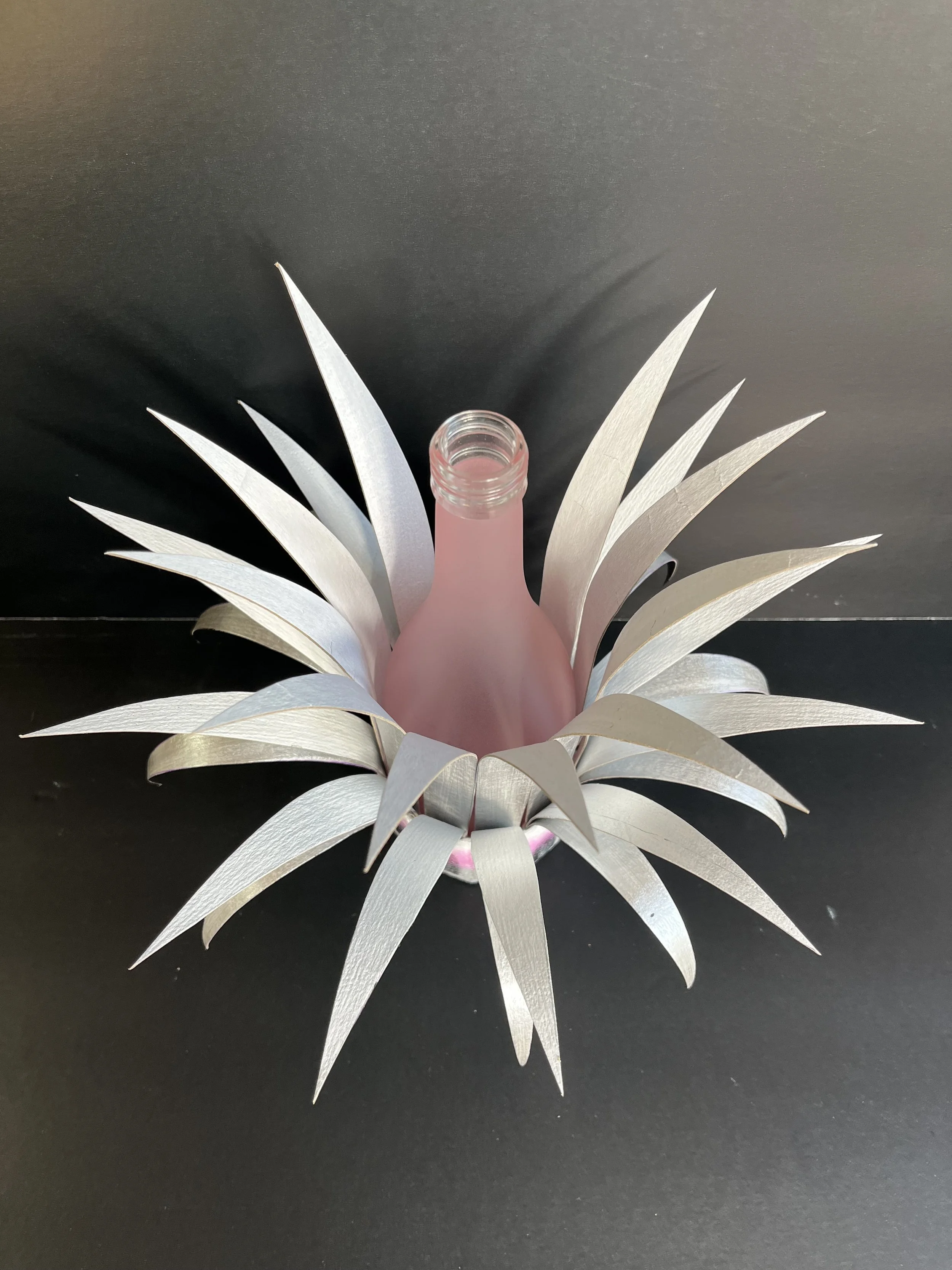 Bottle Crown:  Pink Bottle with Silver and Black Spikes and Pink, Silver and White Base