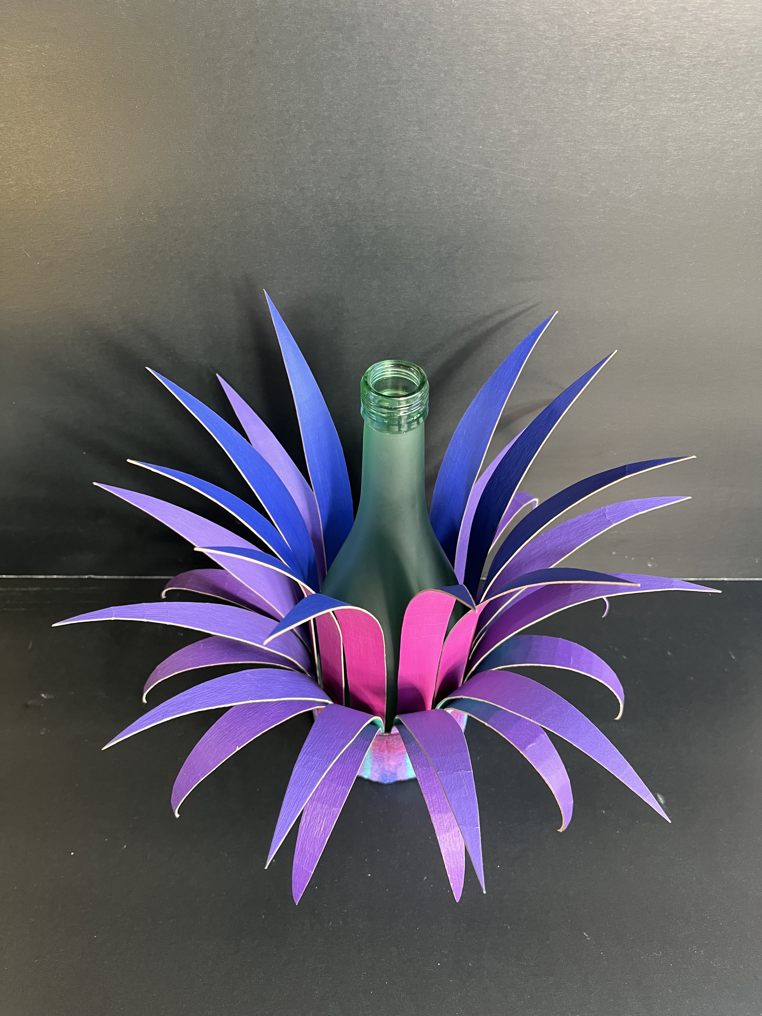 Bottle Crown:  Turquoise Bottle with Pink, Blue, Turquoise and purple Spikes; Pink, Blue, Turquoise and Purple Base.