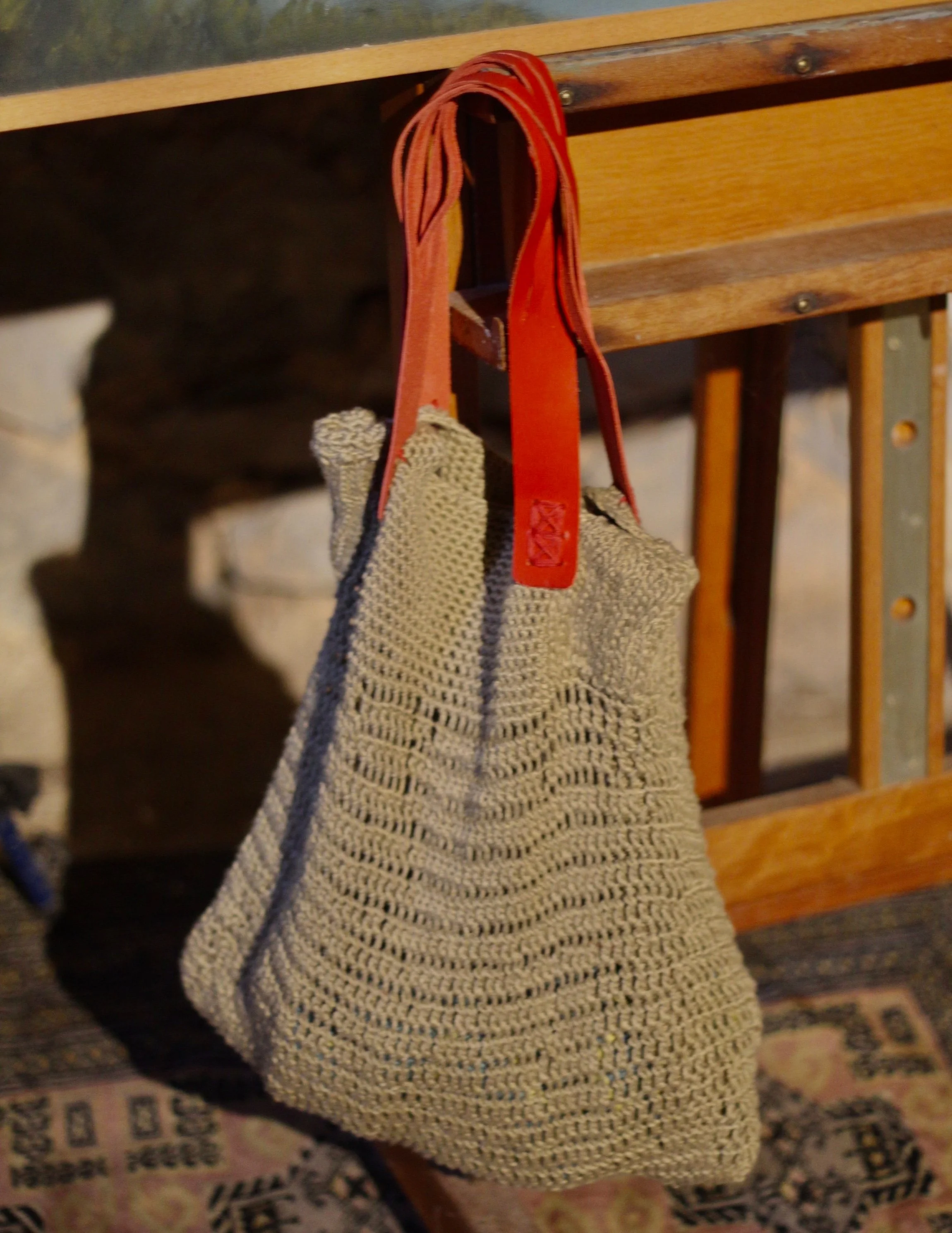 Bolso Saco Beige asas rojas cuero