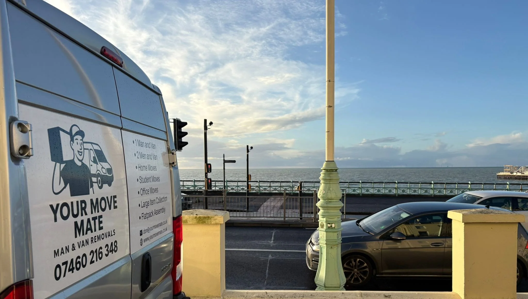 A sussex seaside street view showing a parked your move mate van on the left ready for man and van removal services