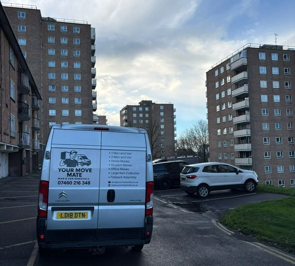 The Your Move Mate van surrounded by apartment buildings in Brighton.