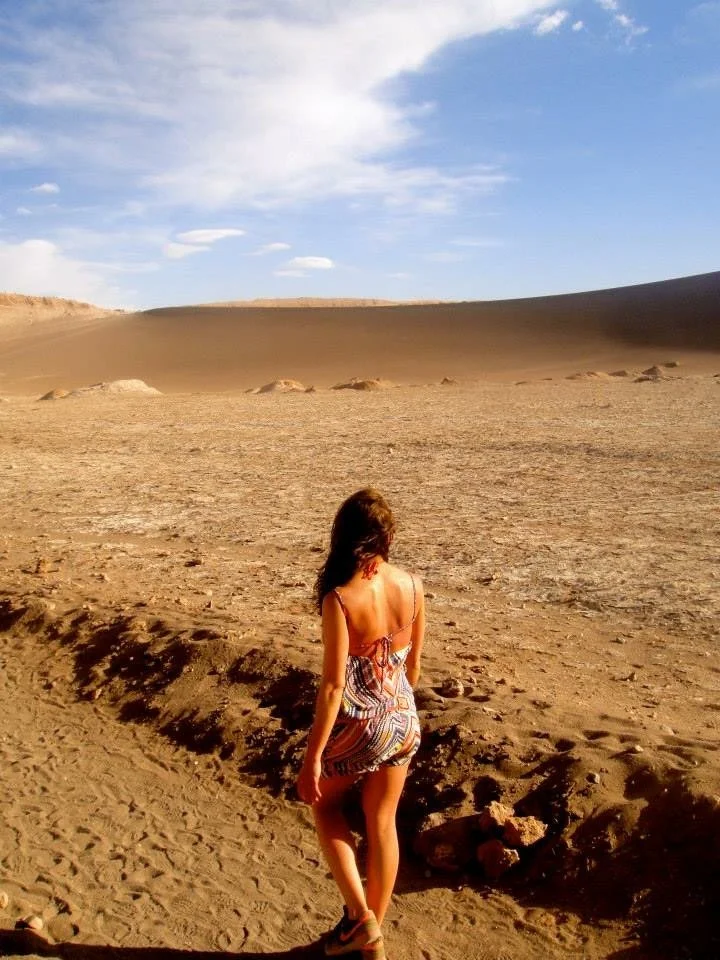 Rita Arslan walking through a desert landscape, symbolising movement, reflection and space