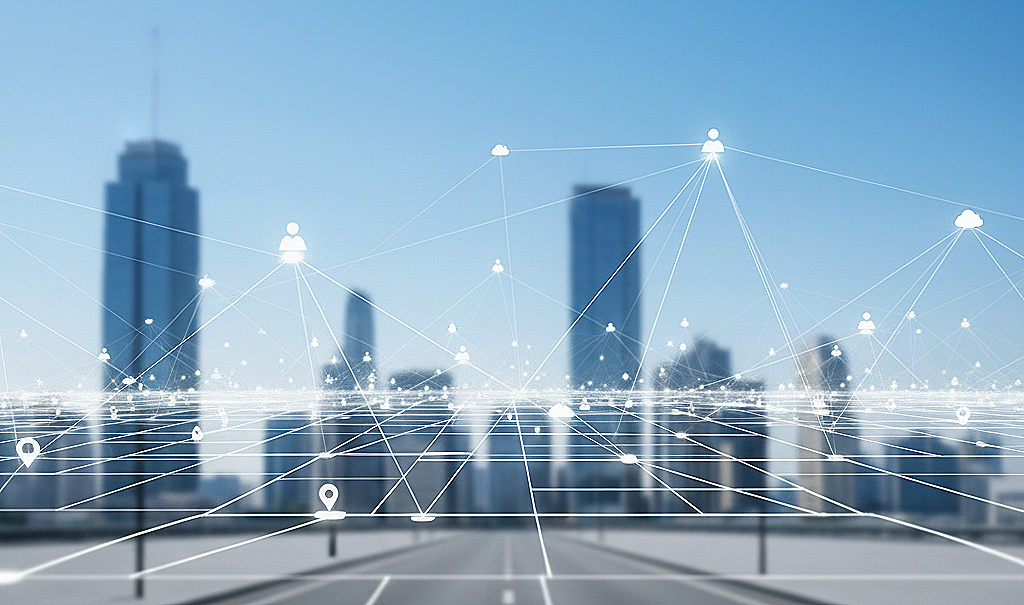 Digital overlay of interconnected icons, including people, clouds, and location pins, over a city skyline with tall buildings and a clear blue sky.