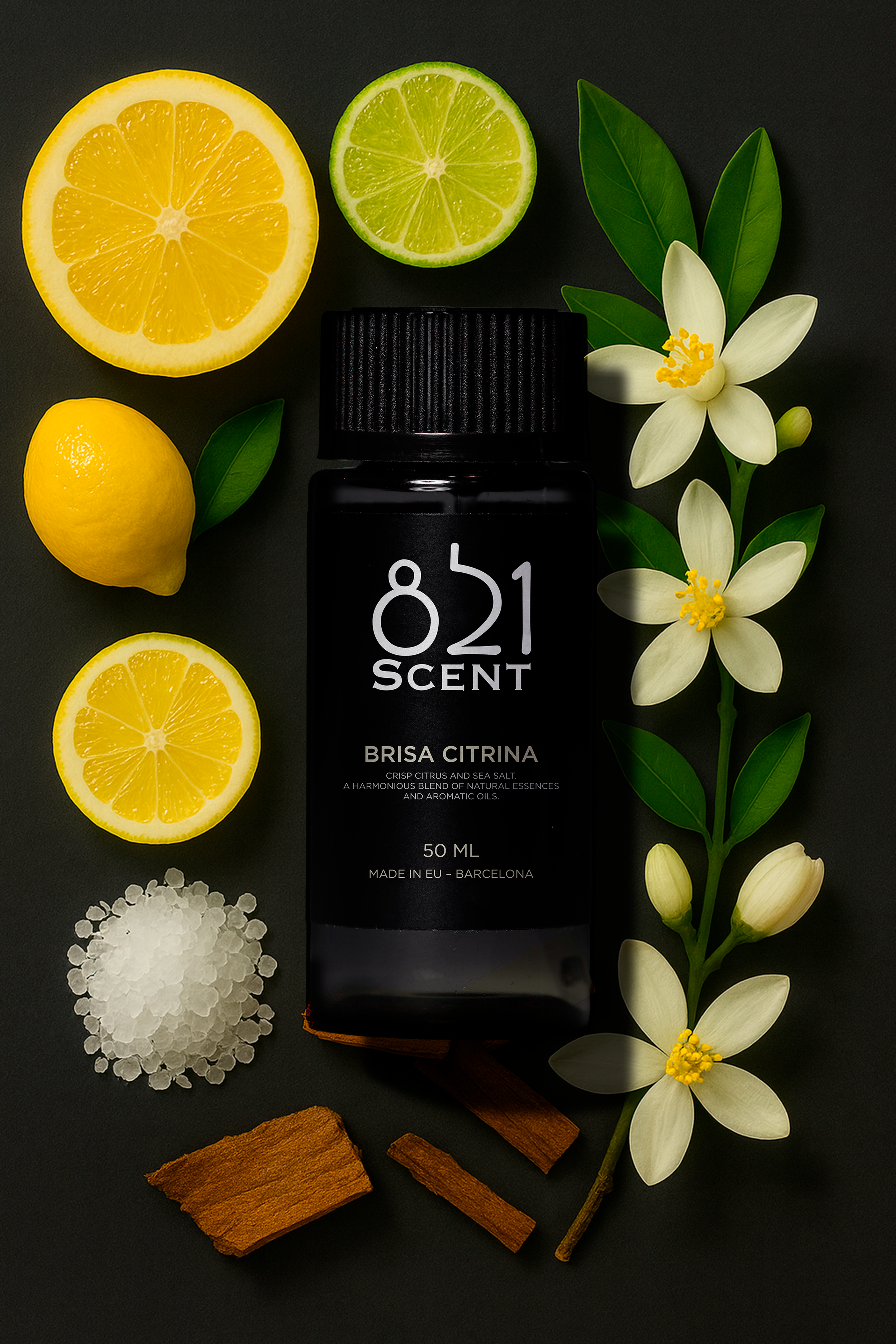 A black bottle labeled "821 Scent" surrounded by lemon slices, a lemon, lime slices, jasmine flowers, green leaves, sea salt crystals, and cinnamon sticks on a dark background.