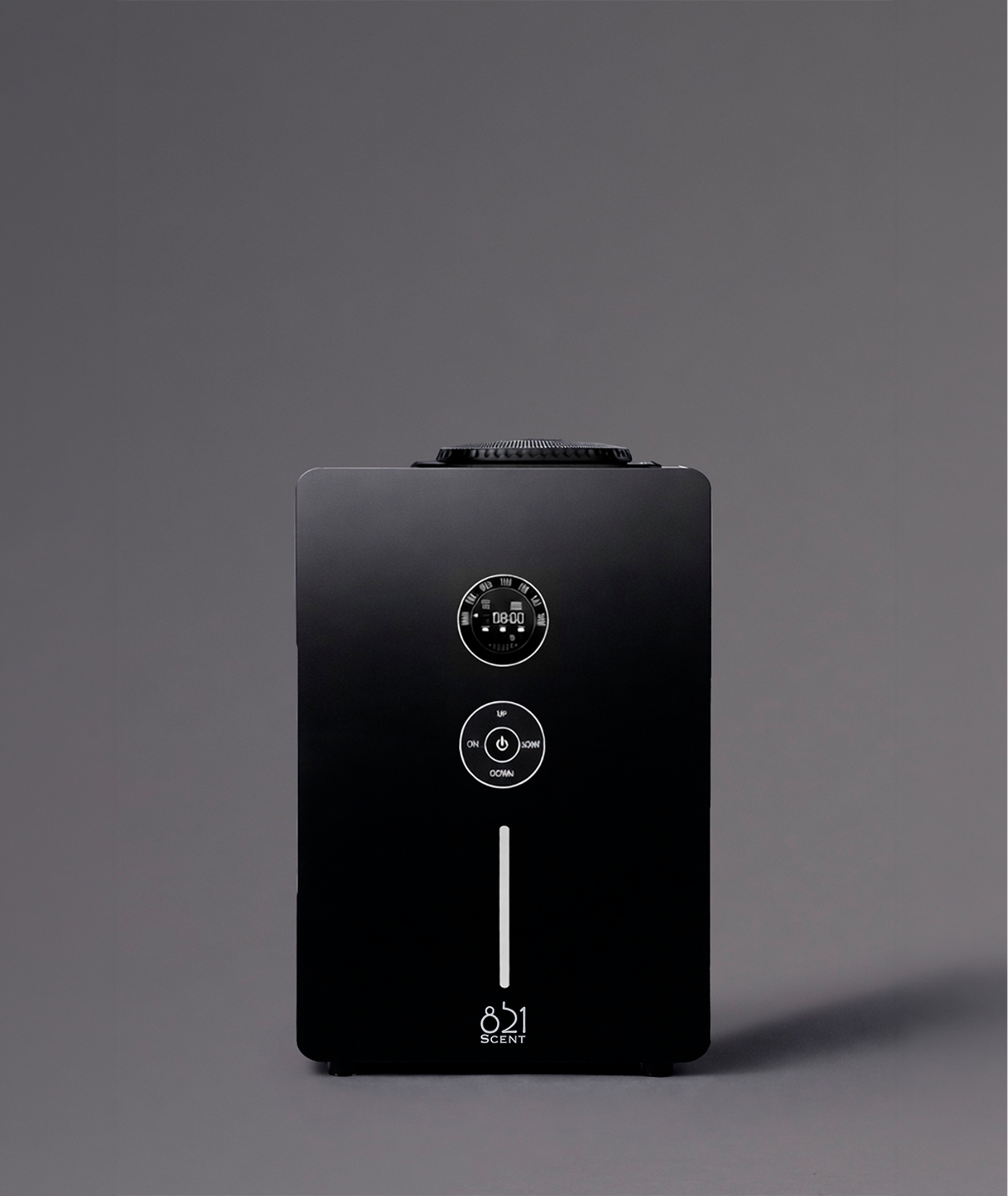 A digital device with a circular display and buttons, set against a gray background.
