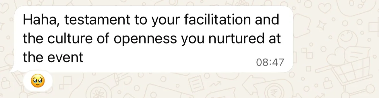 A text message conversation on a phone screen, with a message praising someone's facilitation and openness at an event, sent at 8:47 AM, along with a smiling face with big eyes emoji.