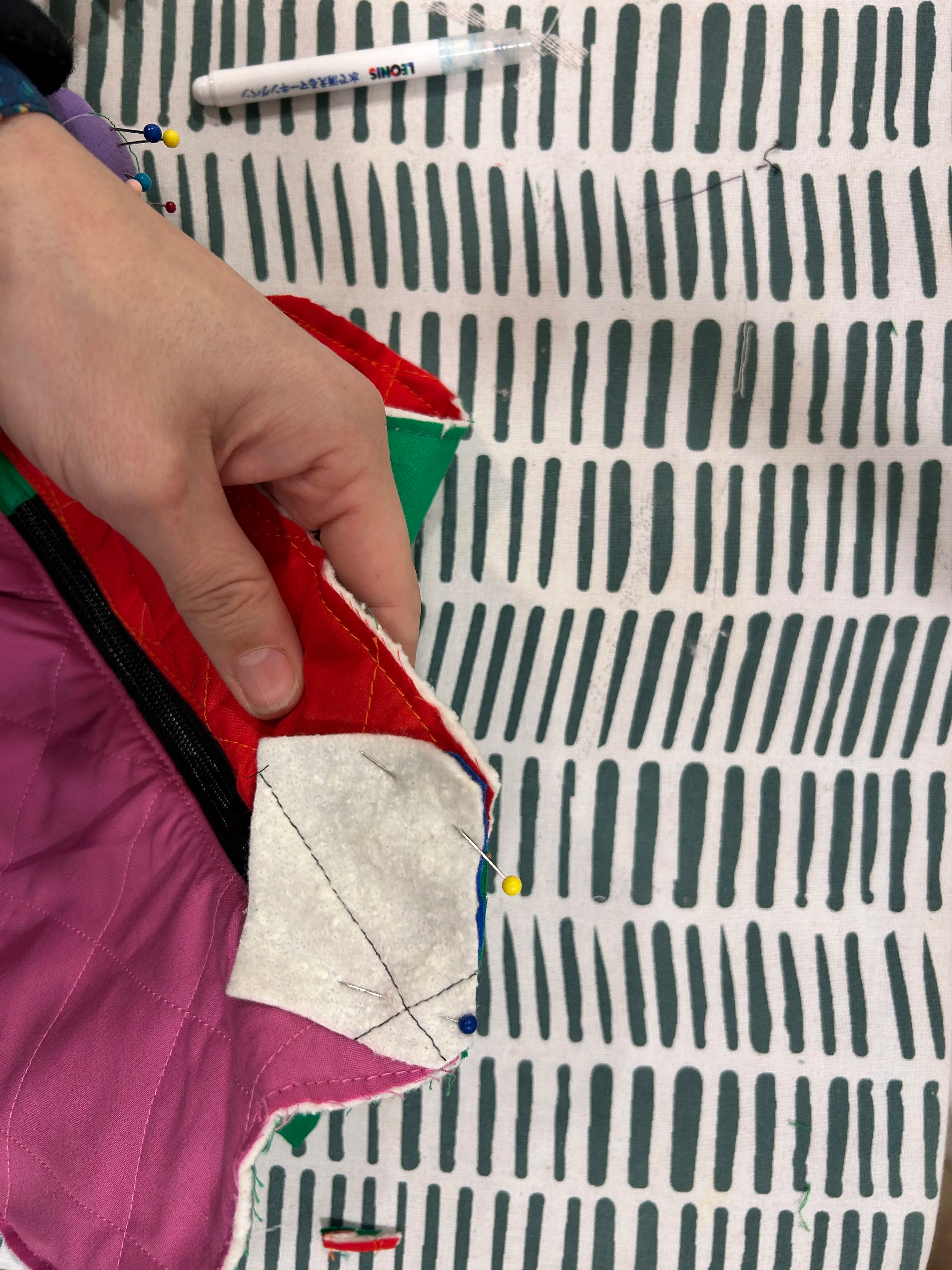 Sandwich the Bag  between the two body extension pieces. The widest part of the piece should be the the edge of the main peice. 