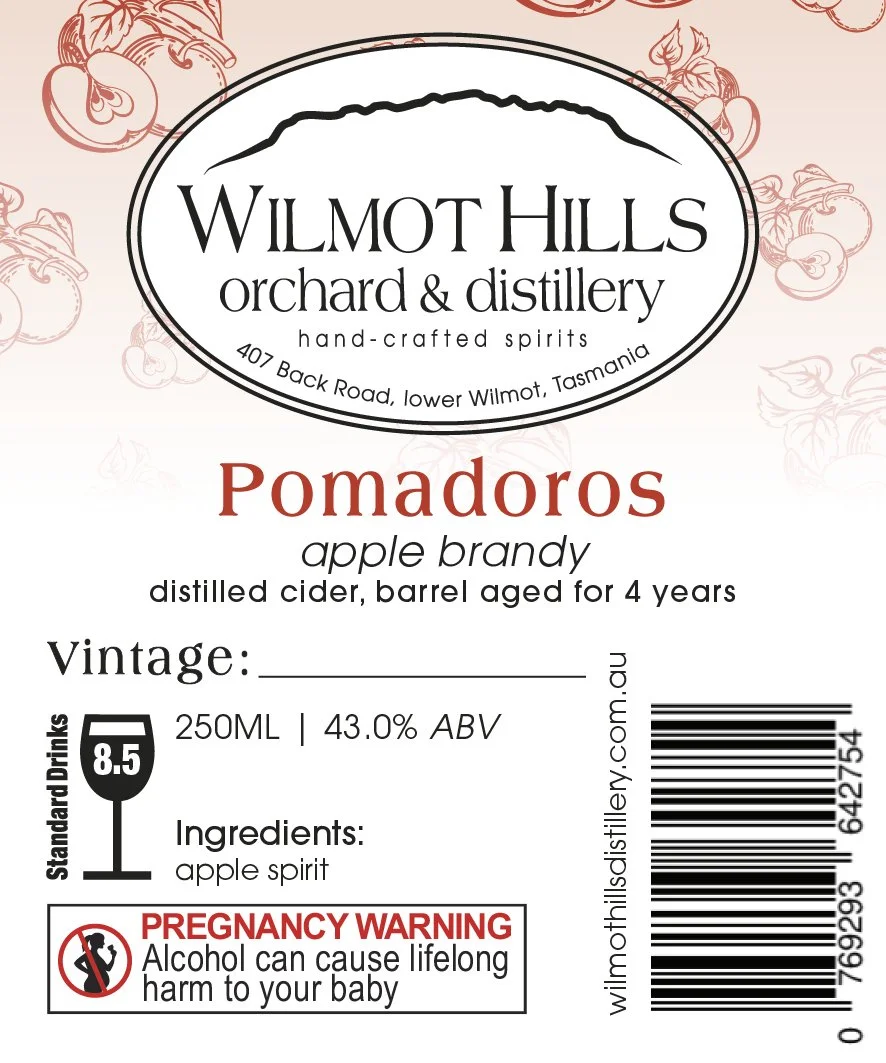 Label for Wilmot Hills orchard & distillery's Pomadoros apple brandy, featuring ingredients, alcohol content, volume, vintage space for date, and a pregnancy warning.