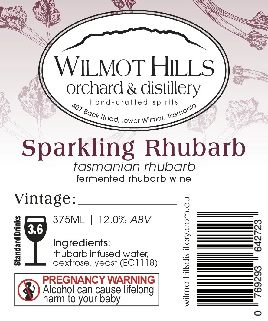 Label for Wilmot Hills Orchard & Distillery sparkling rhubarb fermented rhubarb wine, containing ingredients such as rhubarb infused water, dextrose, and yeast, with a pregnancy warning and barcode.