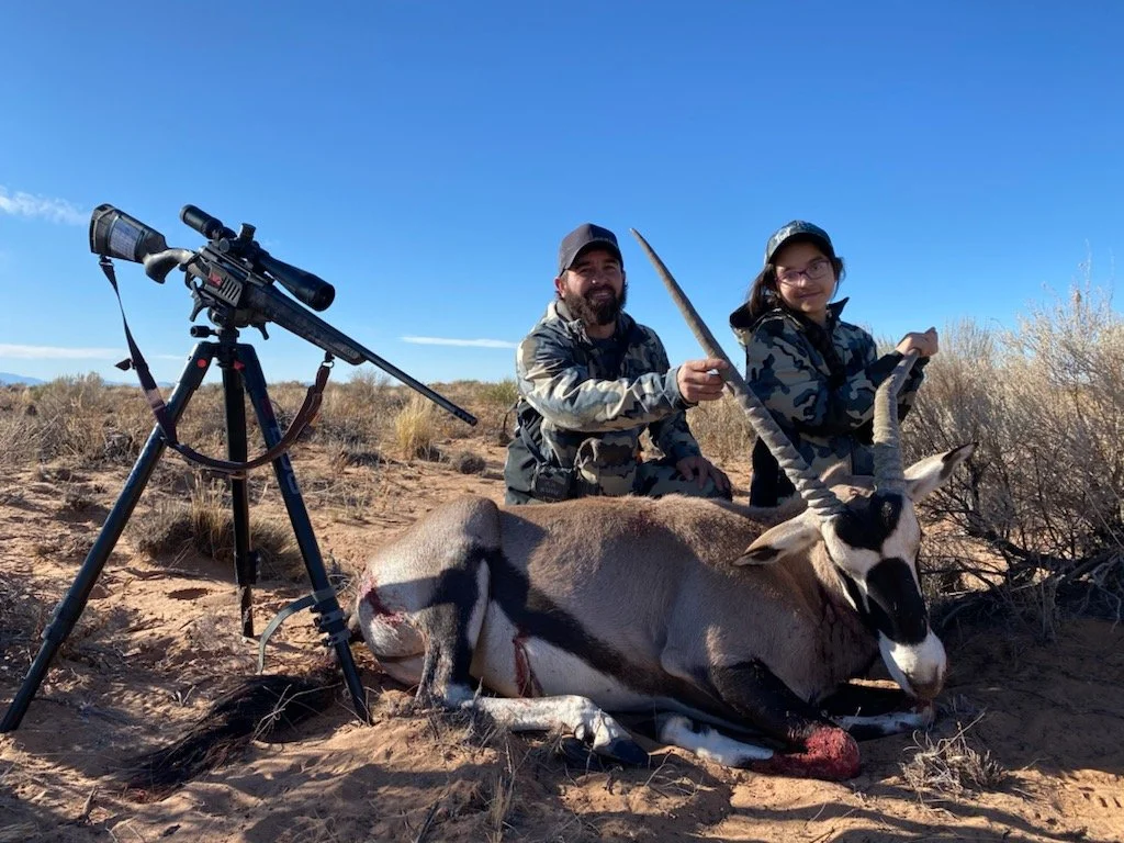 Hunter celebrating a successful guided hunt with Hook N 30 Outfitters