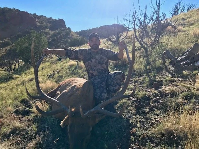 Hunter celebrating a successful guided hunt with Hook N 30 Outfitters