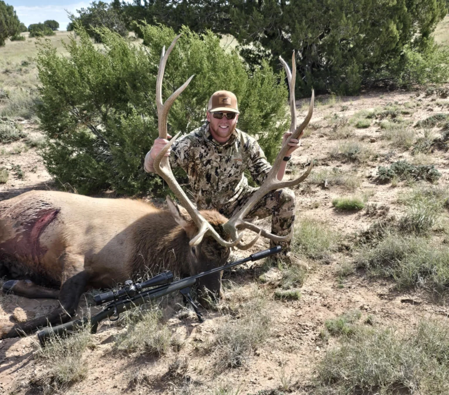 Hunter with trophy elk on a guided hunt with Hook N 30 Outfitters in New Mexico.