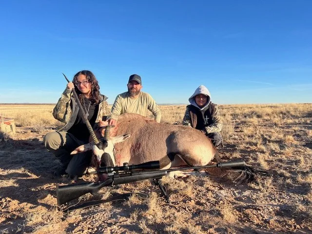 Hunter celebrating a successful guided hunt with Hook N 30 Outfitters